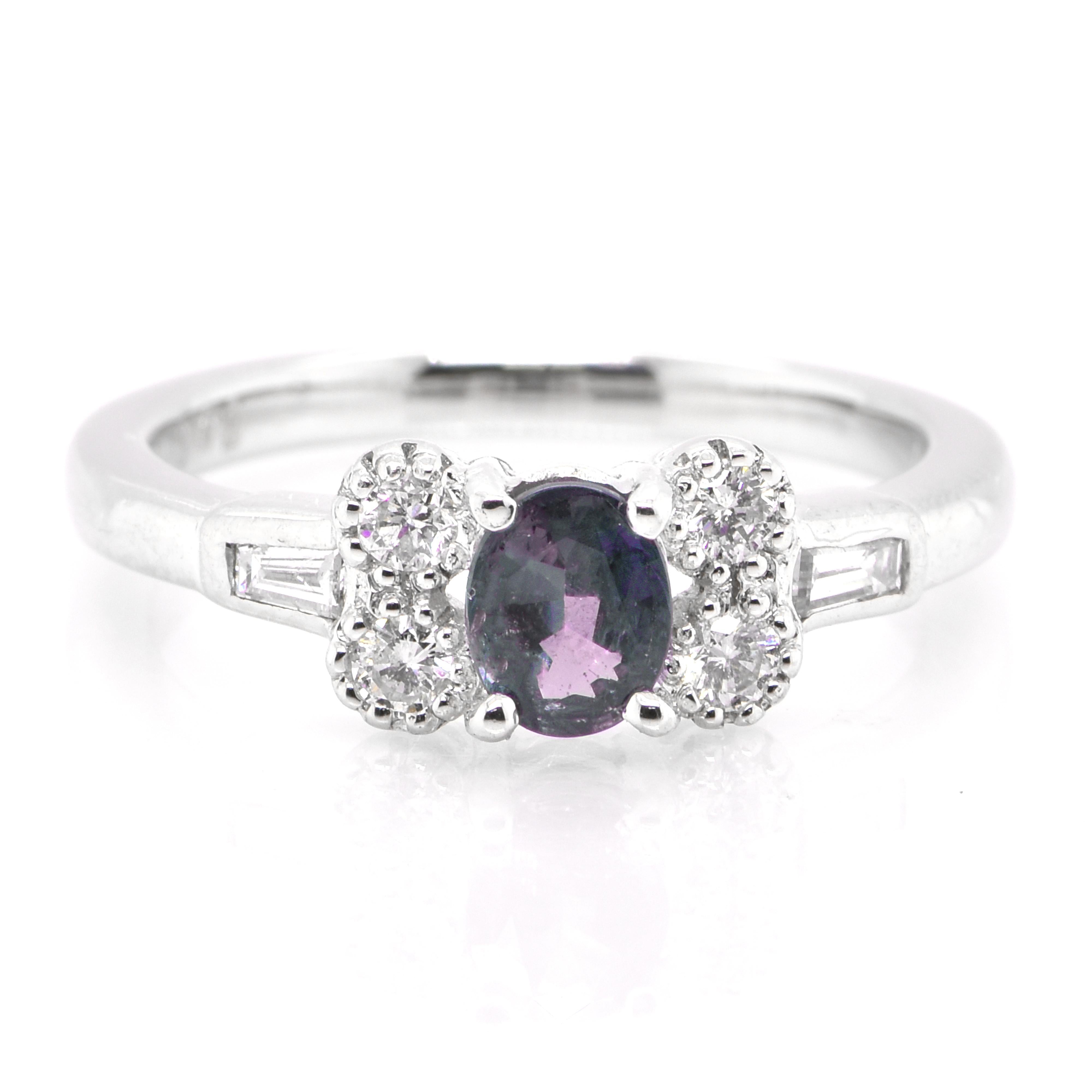 A gorgeous ring featuring a 0.42 Carat, Natural Alexandrite and 0.30 Carats of Diamond Accents set in Platinum. Alexandrites produce a natural color-change phenomenon as they exhibit a Bluish Green Color under Fluorescent Light whereas a Purplish