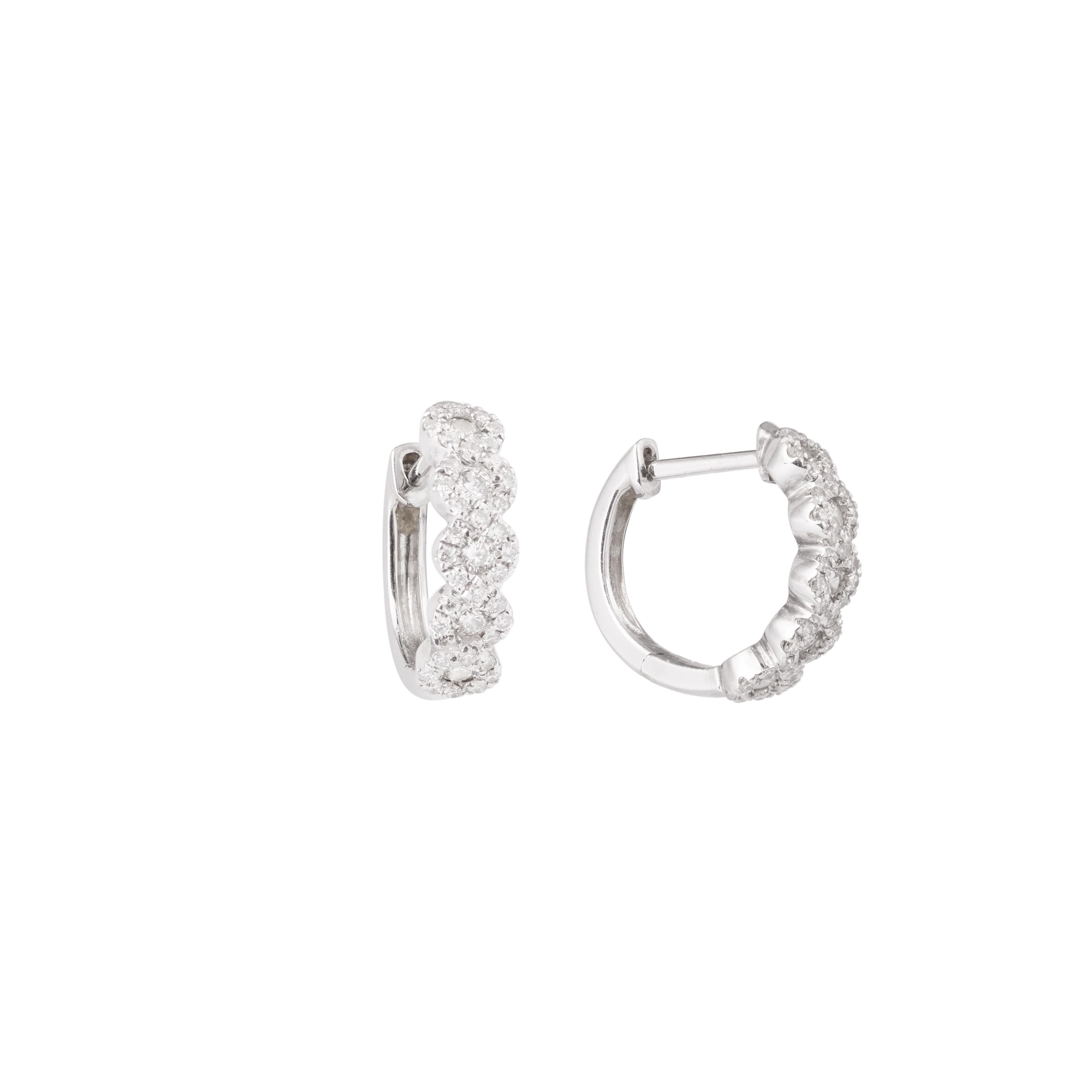 Small white gold hoop earrings set with brilliant cut diamonds.

dimensions : 1.28 x 0.37 cm ( 0,394 x 0 inch)

weight of diamonds: 0.42 carats

total weight: 2.60 g

18 carats white gold, 750/1000th
