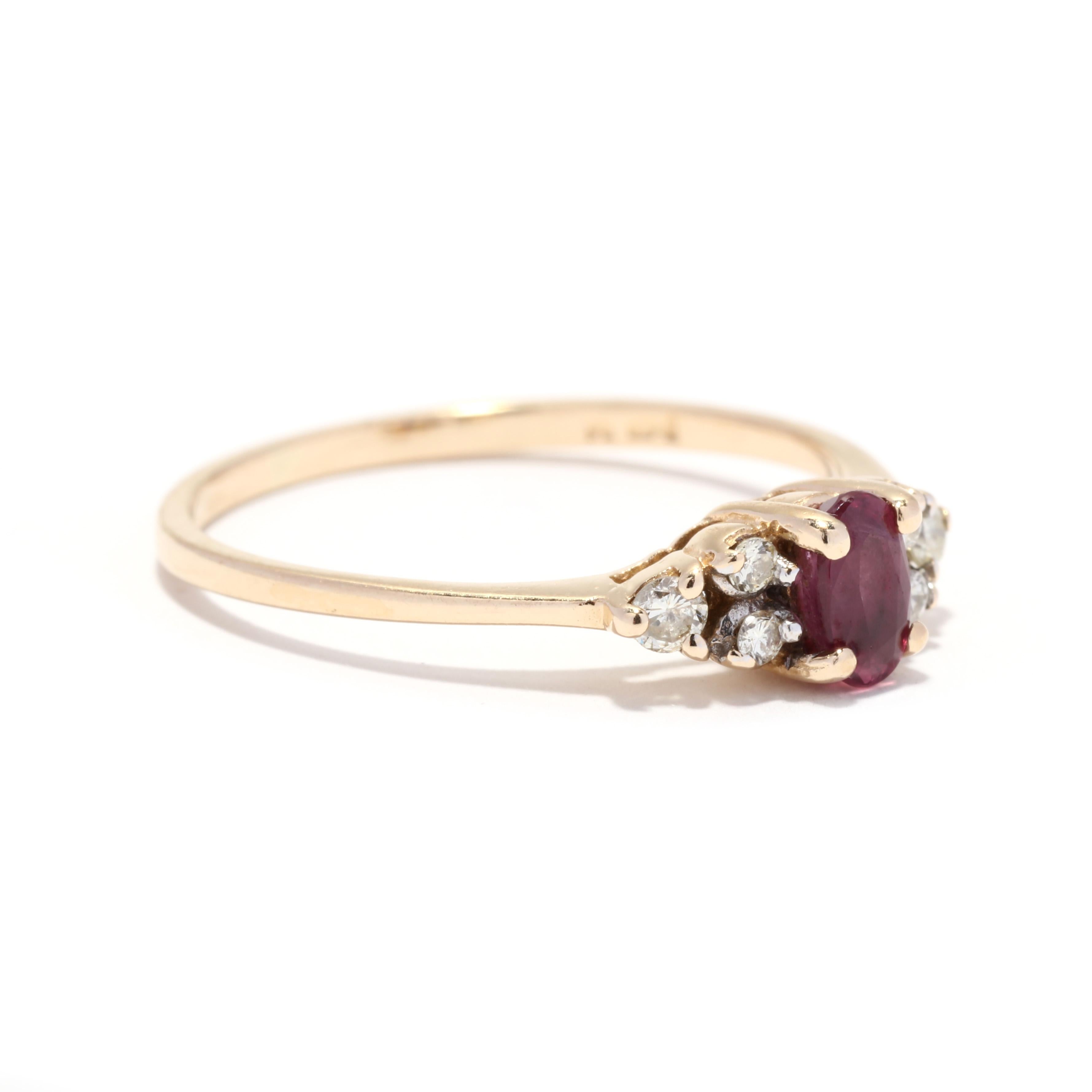 A vintage 14 karat yellow gold ruby and diamond ring. This ring features a prong set, oval cut ruby weighing approximately .32 carat with three round brilliant cut diamonds on either side weighing approximately .10 total carats and with a thin