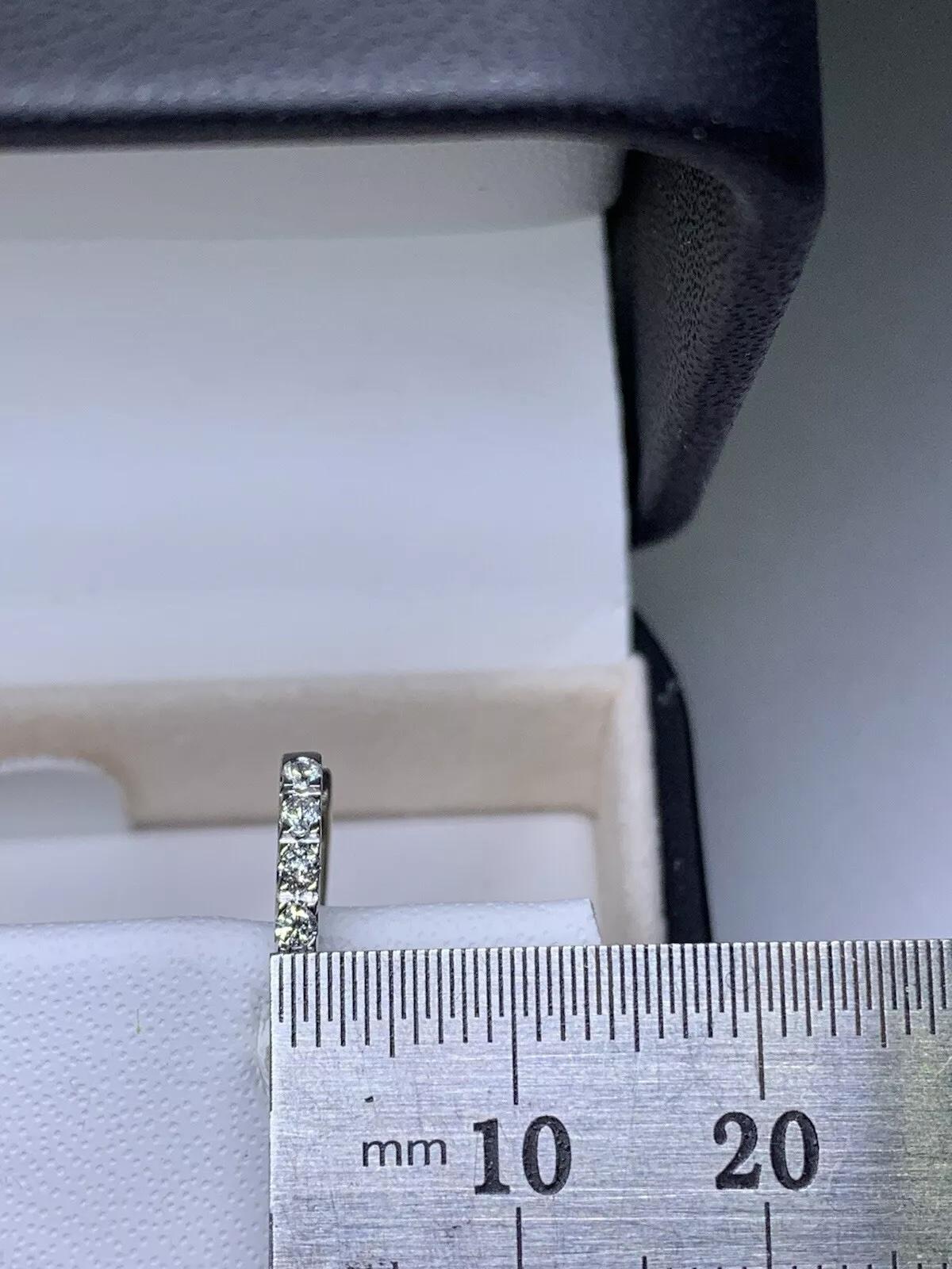 Elevate your jewellery collection with these stunning 0.42ct Diamond Hoop Huggie Earrings. Crafted from 18ct White Gold, these earrings are a timeless piece that will never go out of style. The earrings feature a classic hoop design with a huggie