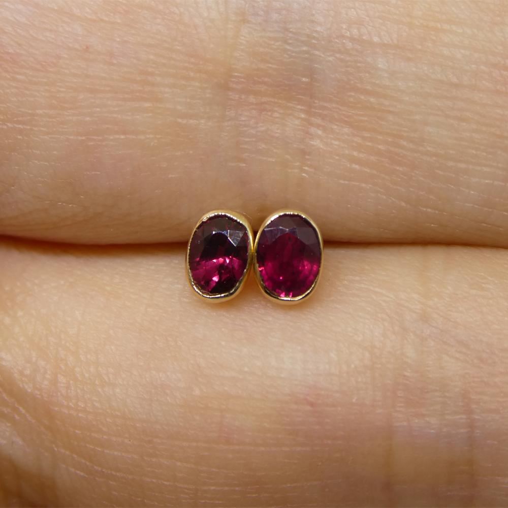 Description:

Stone Type: Ruby
Number of Stones: 2
Weight: 0.42 carats total weight
Measurements: 4.00 x 3.00 x 1.80 mm
Shape: Oval
Cutting Style: Crown: Brilliant Cut
Cutting Style: Pavilion: Step Cut
Transparency: Transparent
Clarity: Very