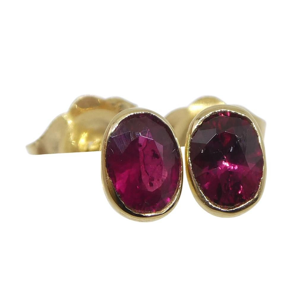 Contemporary 0.42ct Oval Red Ruby Stud Earrings set in 14k Yellow Gold For Sale