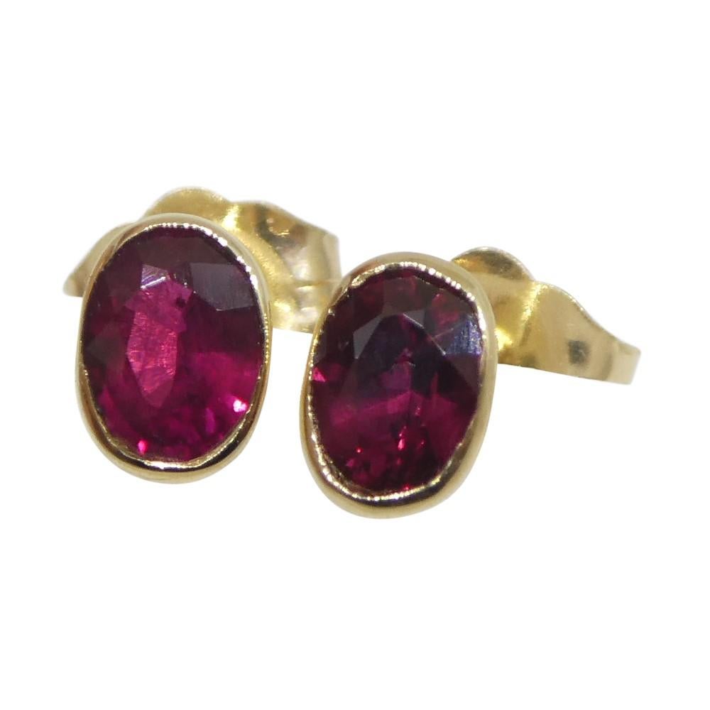 Brilliant Cut 0.42ct Oval Red Ruby Stud Earrings set in 14k Yellow Gold For Sale