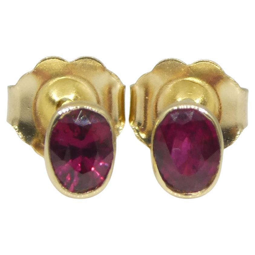 0.42ct Oval Red Ruby Stud Earrings set in 14k Yellow Gold For Sale
