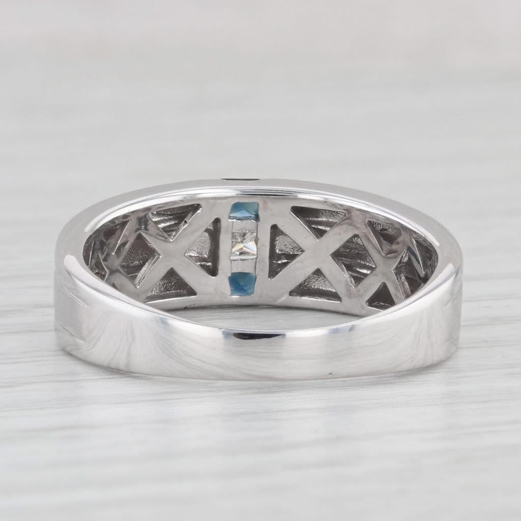 Gemstone Information:
- Natural Sapphires -
Total Carats - 0.30ctw
Cut - Princess 
Color - Dark Blue
Treatment - Heated

- Natural Diamonds -
Carats - 0.10ct
Cut - Princess
Color - G - H
Clarity - SI1 

Metal: 14k White Gold
Weight: 6.1 Grams
