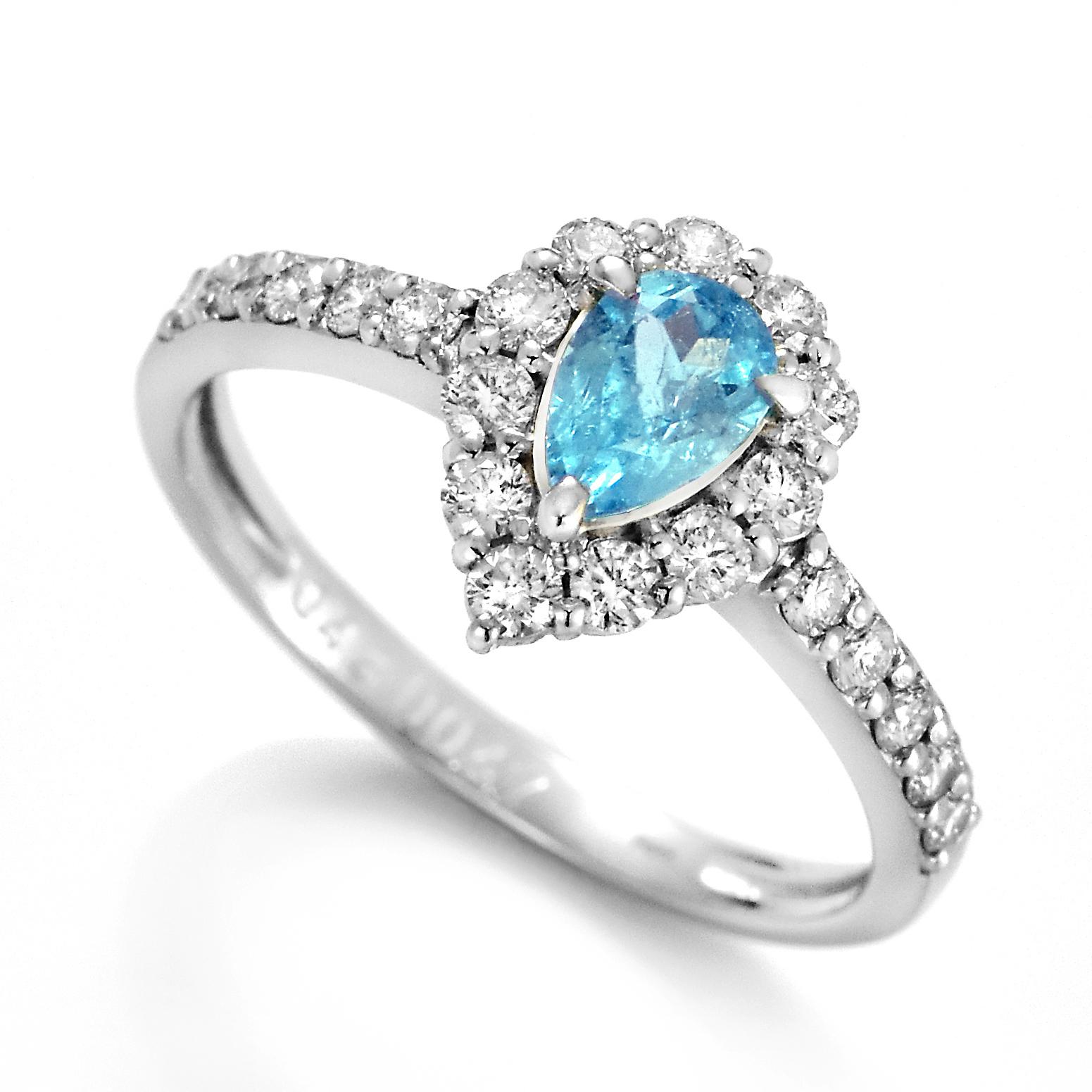 A beautiful ring featuring a 0.43 Carat Natural, Neon Blue Brazilian Paraiba Tourmaline and 0.47 Carats of Diamond Accents made in Platinum. Paraiba Tourmalines were only discovered 30 years ago in the Brazilian state of the same name- Paraiba.