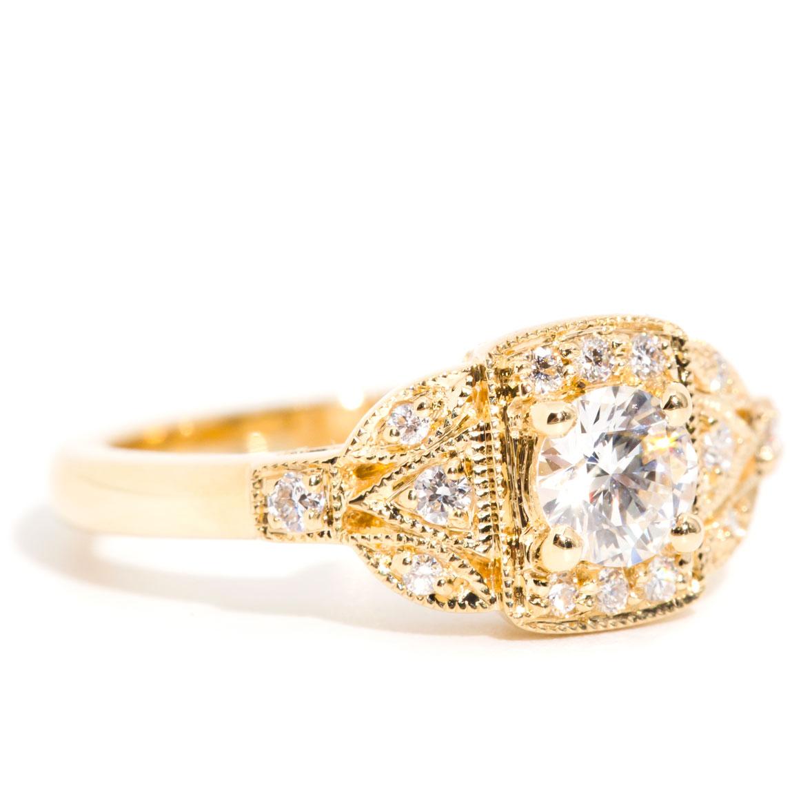 Carefully crafted in 18 carat yellow gold is this gorgeous vintage-inspired diamond cluster ring featuring a stunning 0.43 carat round brilliant cut diamond embellished with a plethora of sparkling round brilliant cut diamonds. We have name this