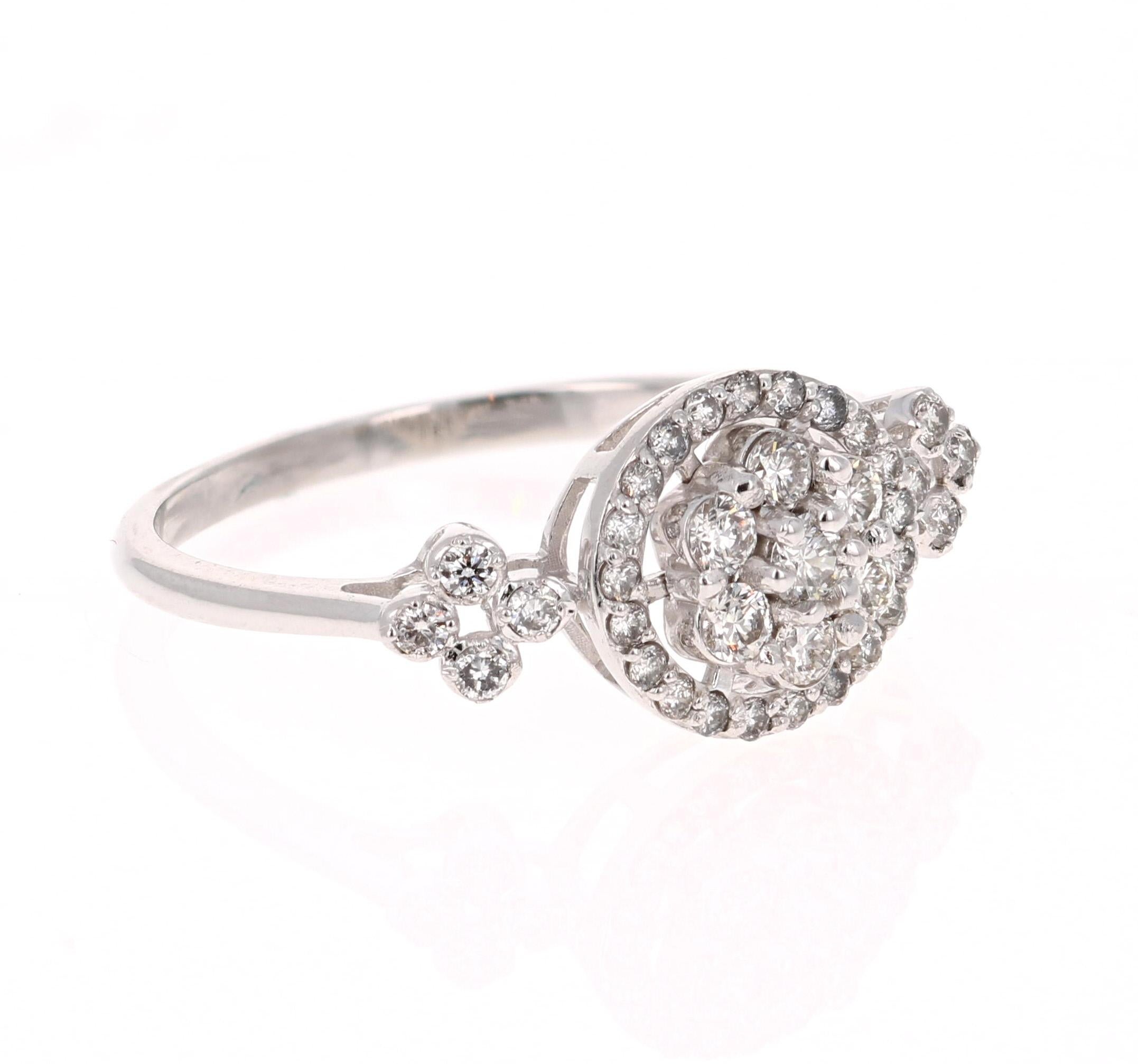 This ring has 36 Round Cut Diamonds that weigh 0.43 Carats. 

It is beautifully set in 18 Karat White Gold and weighs approximately 2.3 grams

The ring is a size 7 and can be re-sized free of charge. 
