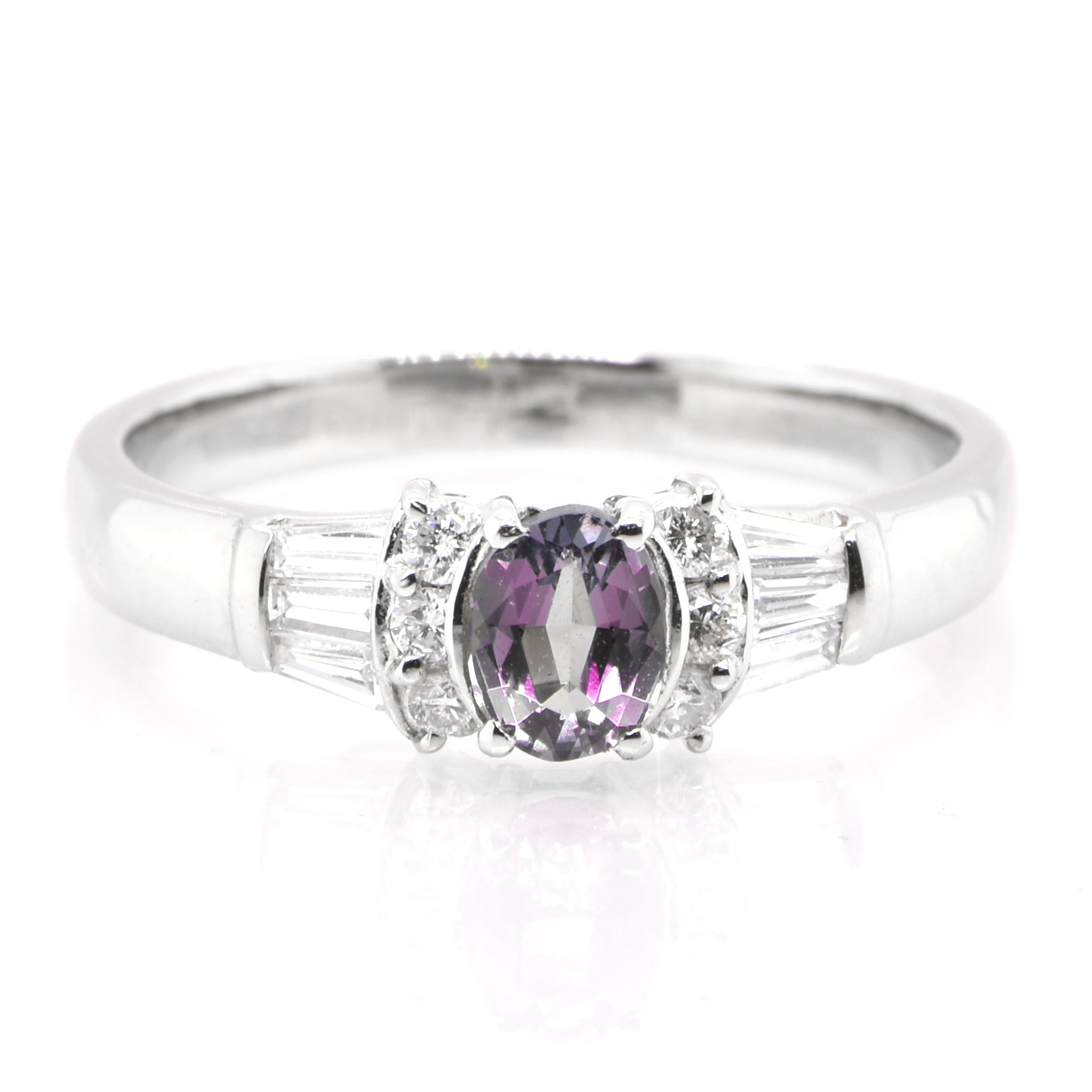 A gorgeous ring featuring a 0.43 Carat, Natural Alexandrite and 0.33 Carats of Diamond Accents set in Platinum. Alexandrites produce a natural color-change phenomenon as they exhibit a Bluish Green Color under Fluorescent Light whereas a Purplish