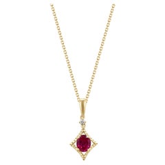 0.43 Carat Oval-Cut Ruby With Diamond accents 10K Yellow Gold Pendant.