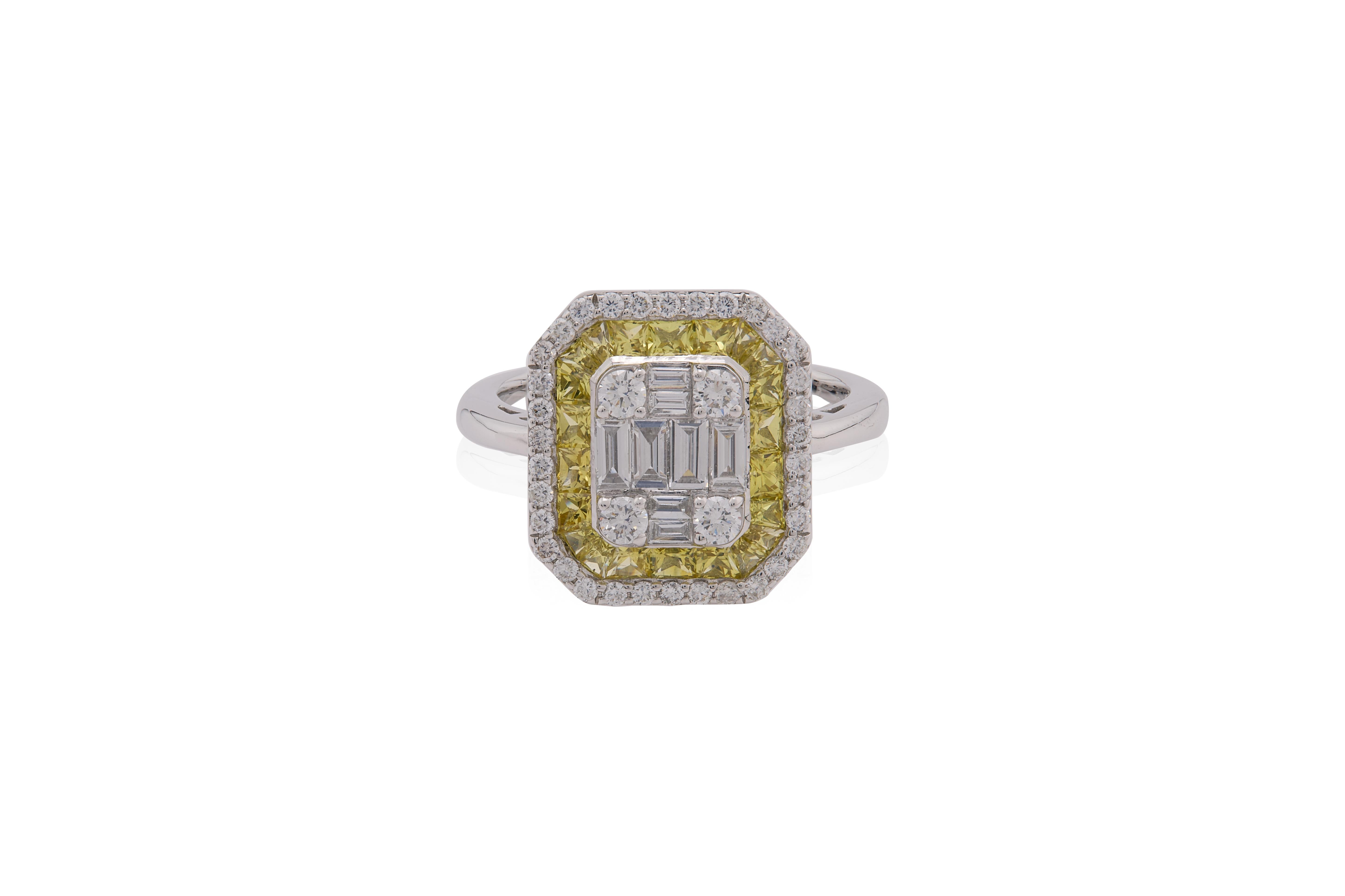 Cette bague exquise est un luxueux mélange d'élégance classique et de design contemporain. En son centre se trouve un arrangement rectangulaire d'éblouissants diamants blancs de taille baguette, flanqué de quatre diamants ronds de taille brillant,