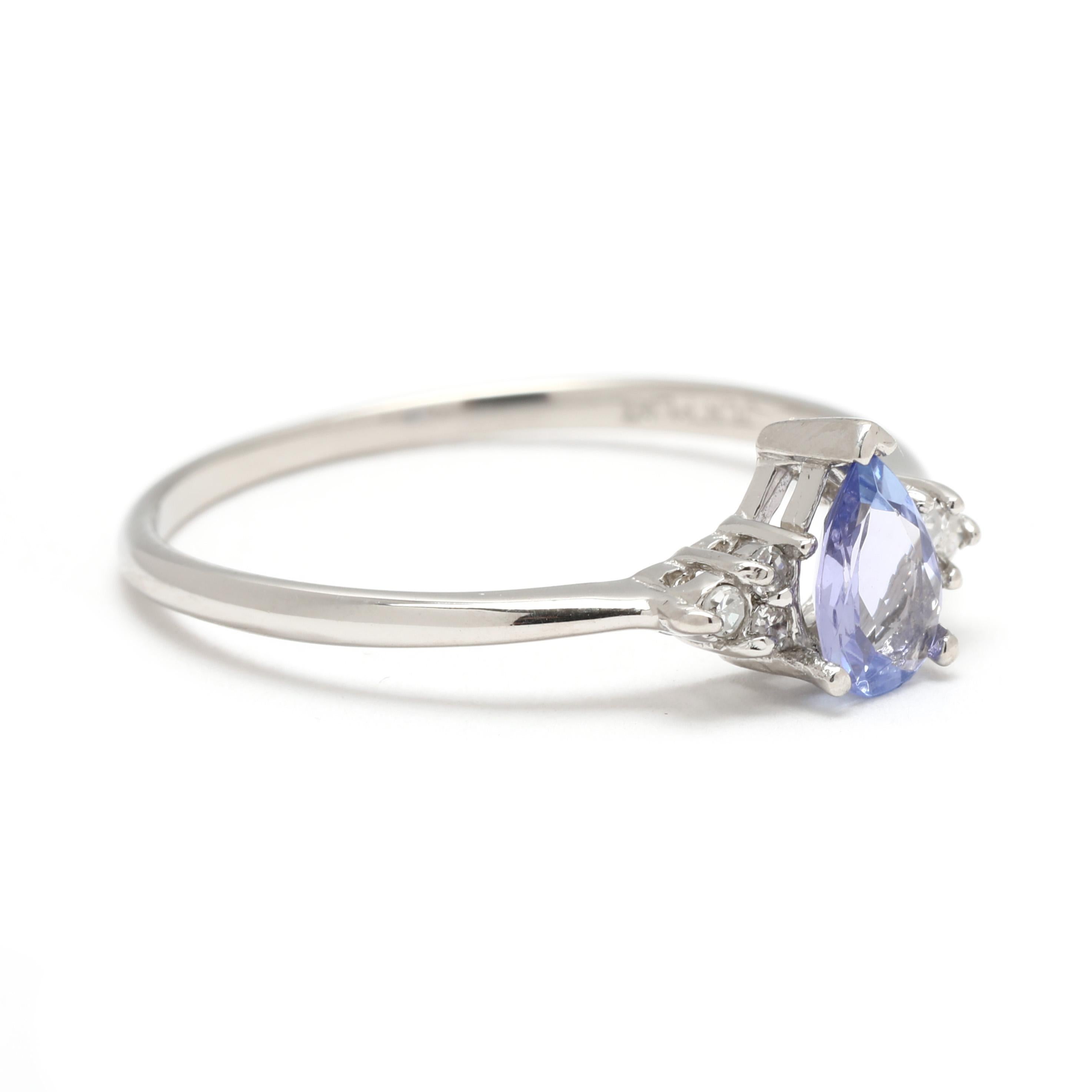 Stones;
tanzanite, 1 stone
pear
6 x 4 mm
approximately .40 carat
*minute chip
diamonds, 6 stones
single cut round
1-1.2 mm
approximately .03 total carats
G-H color, SI1-2 clarity

Ring Size 7.25

Length: 6.7 mm

Weight: 1.2 dwts. / 1.8