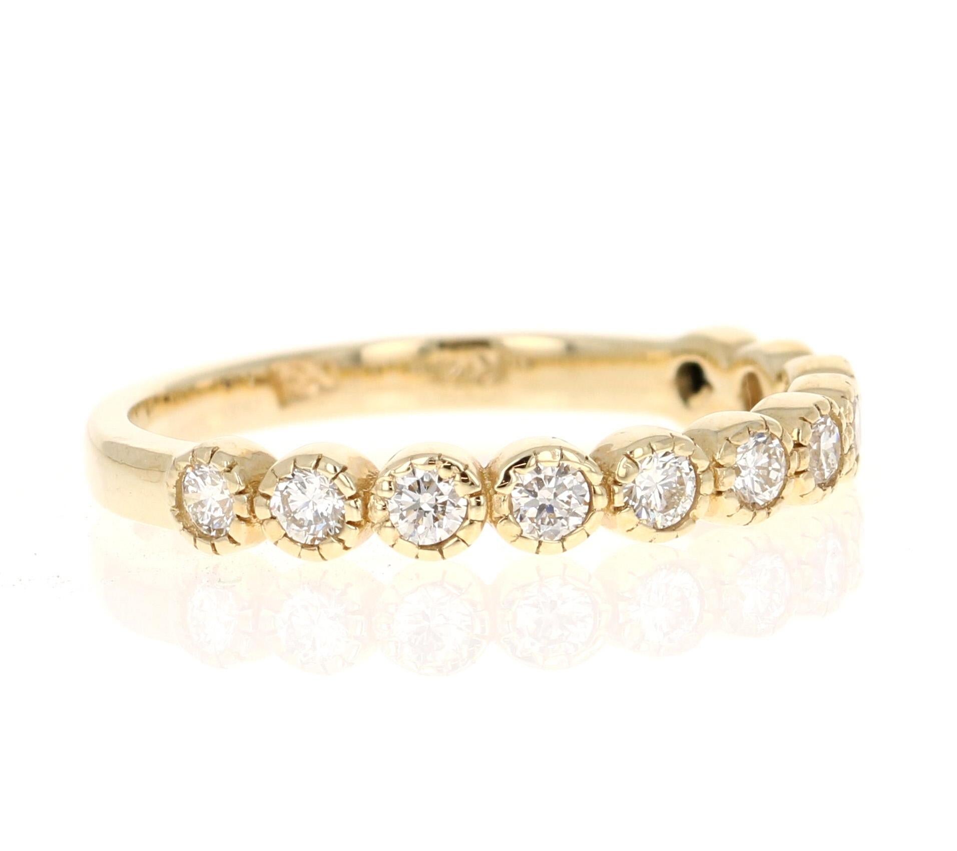 This band has Natural Round Cut Diamonds that weigh 0.44 carats and has a clarity and color of VS-H. The band is beautifully set in 14 Karat Yellow Gold and is made in a bezel set which keeps the stones secure.

Wear this ring stacked with others or