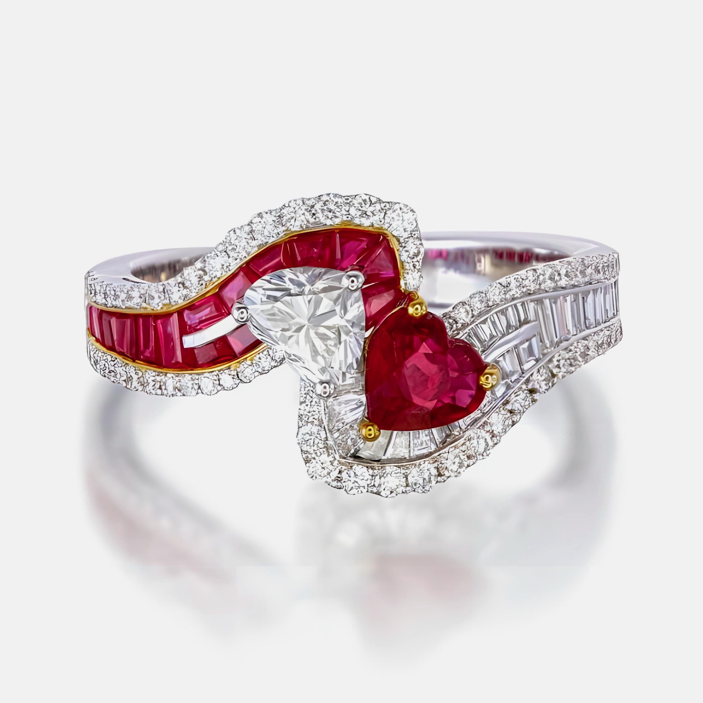 This ring features a 0.44-carat heart-cut ruby, paired with a 0.43-carat heart-cut diamond for a romantic, eye-catching look. Surrounding these center stones are 0.30 carats of tapered baguette rubies, 0.25 carats of tapered baguette diamonds, and