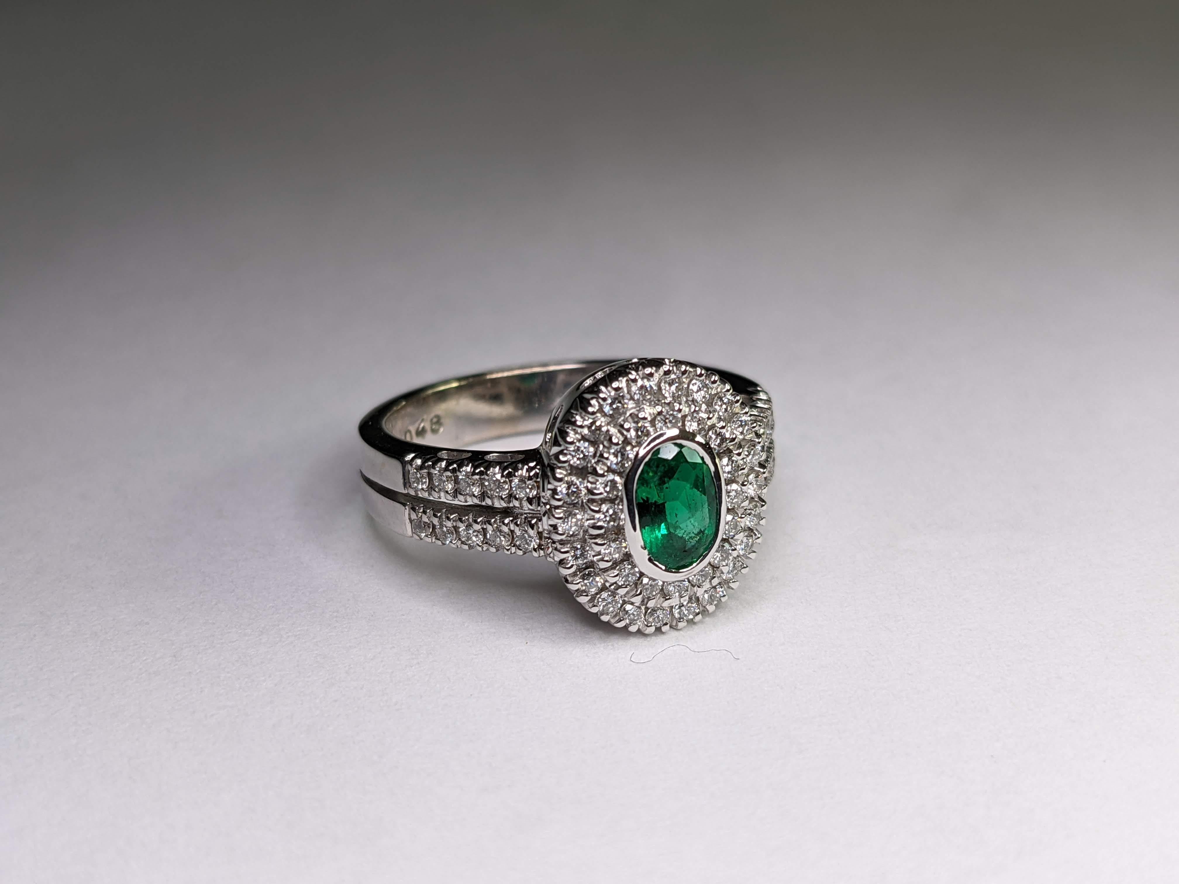 Oval Cut 0.44 Carat Natural Oval Emerald 0.48 Carat White Diamonds 18 Karat Gold Ring For Sale