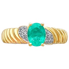 0.44 Carat Oval-Cut Colombian Emerald and Diamond 14 Karat Gold Engagement Ring