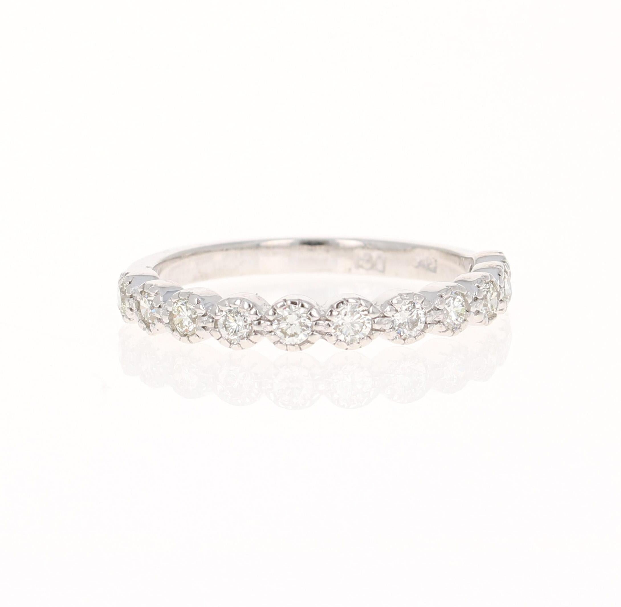 A beautiful band that can be worn as a single band or stack with other bands in other colors of Gold! 

This ring has 11 Round Cut Diamonds that weigh 0.44 Carats. The clarity and color of the diamonds are VS-H.

Crafted in 14 Karat White Gold and