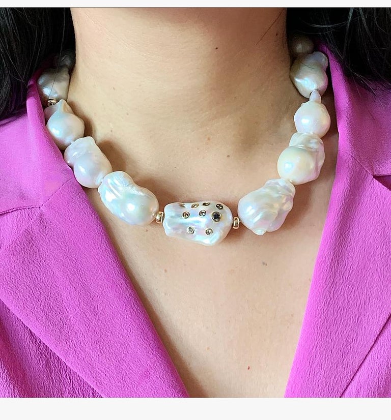 Inspired by Jackie Kennedy Onassis, one of the greatest style icons of the last century embodying timeless classic style, this is not your average Pearl strand.

Cultured Freshwater Baroque Pearls are knotted in between each pearl, and embedded with