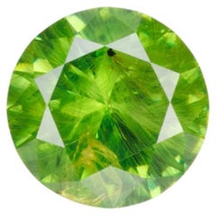 0.44 ct, Faceted Russian Demantoid with bissolite inclusions