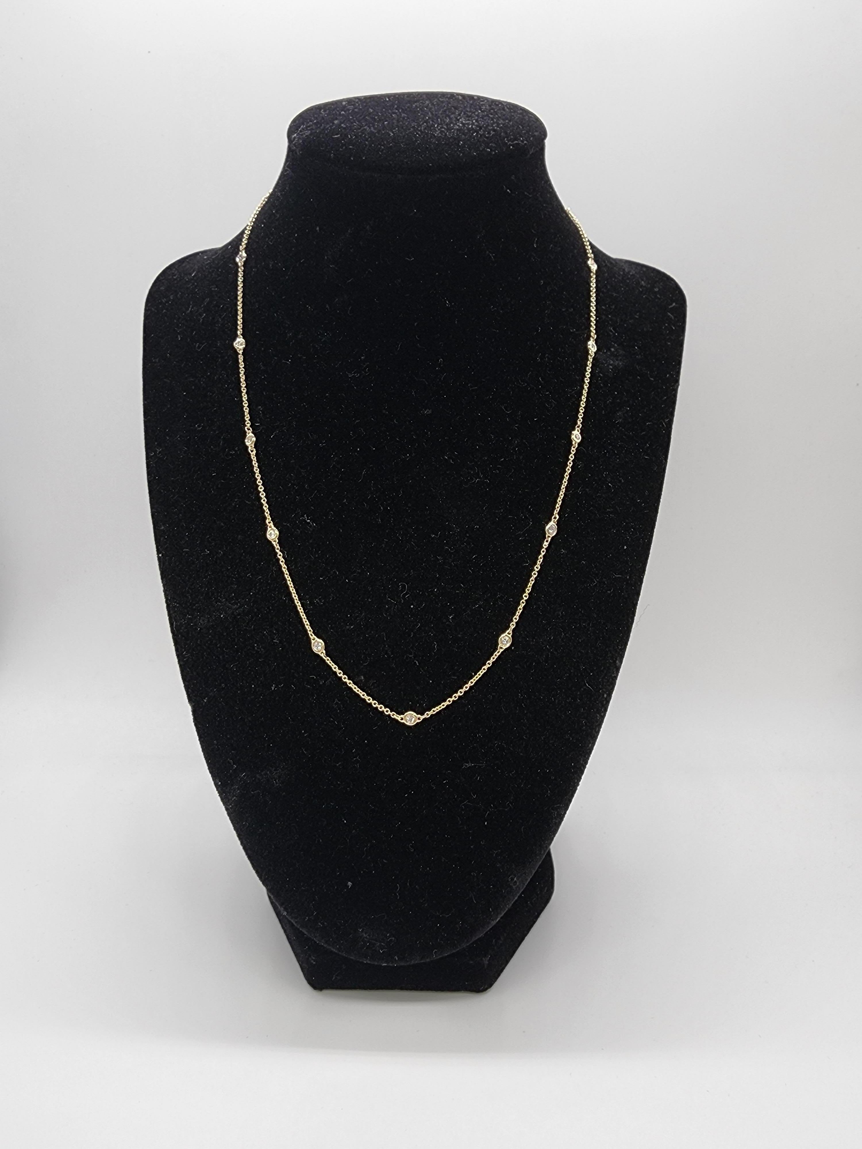 15 Station Diamond by the yard necklace set in Italian made 14K Yellow gold. The total weight is 0.45 carats. Beautiful shiny stones. The total length is 18 inch.