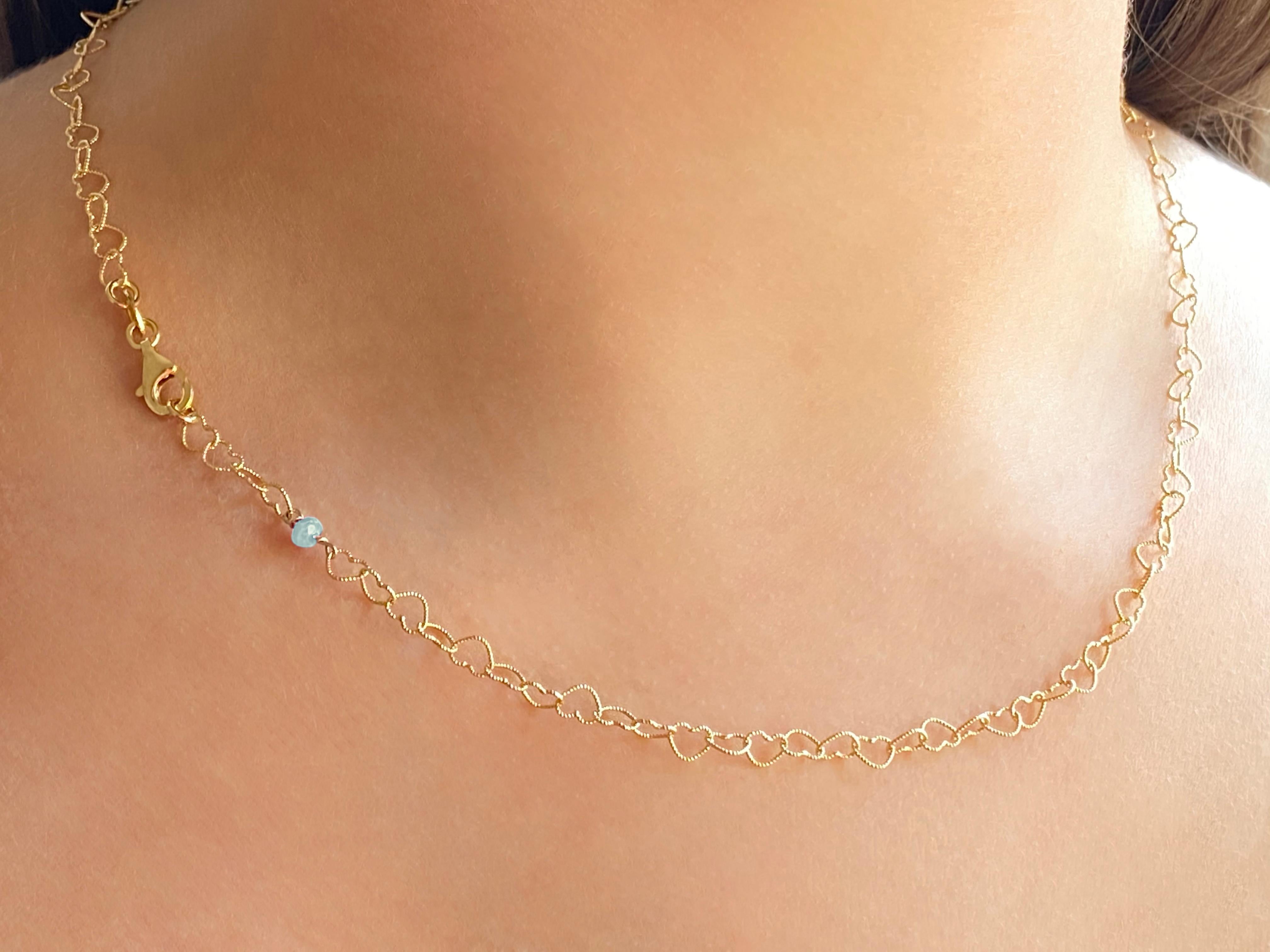 Rossella Ugolini Design Collection 0.45 Carat Bead Cut Aquamarine 18 Karat Yellow Gold Little Hearts Chain Necklace
A nice necklace handcrafted in 18 karats yellow gold and embellished with an aquamarine that fits every outfit due to its semplicity.