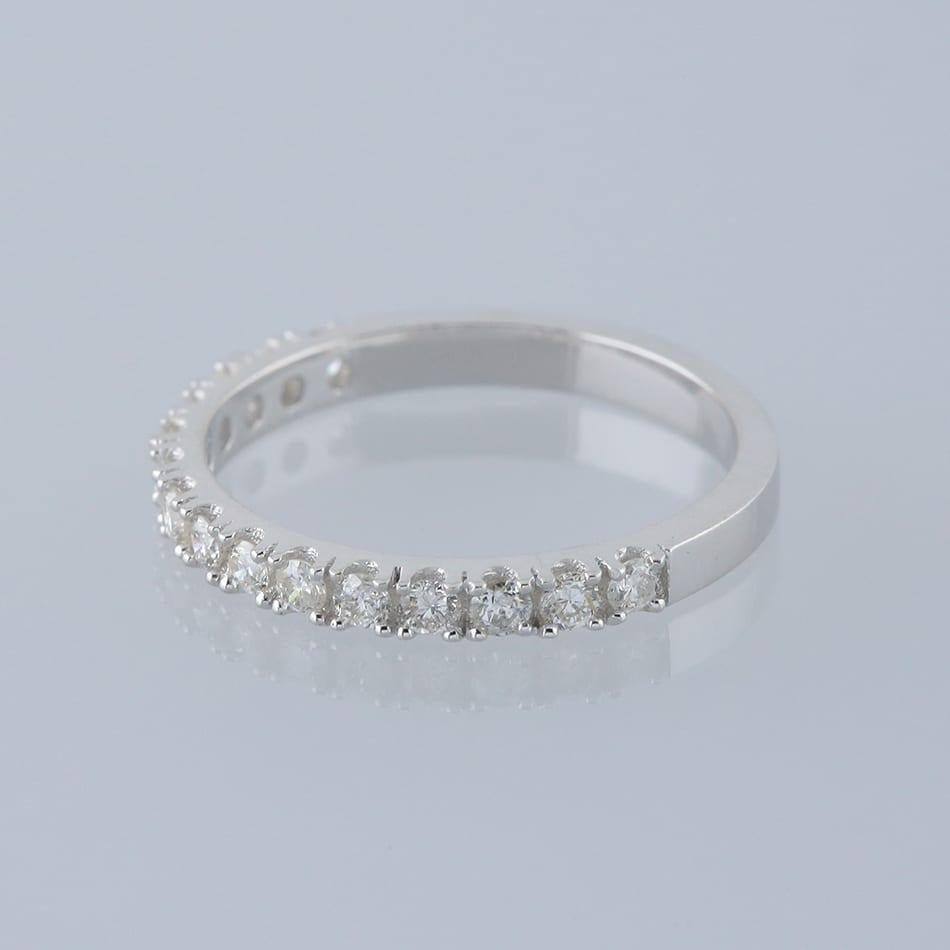 This is an 18ct white gold diamond half eternity ring. The ring features 15 claw set round brilliant cut diamonds.

Condition: Used (Excellent)
Weight: 2.4 grams
Size: L
Band Width: 2.5mm
Total Diamond Carat Weight: Approx. 0.45 carats
Diamond