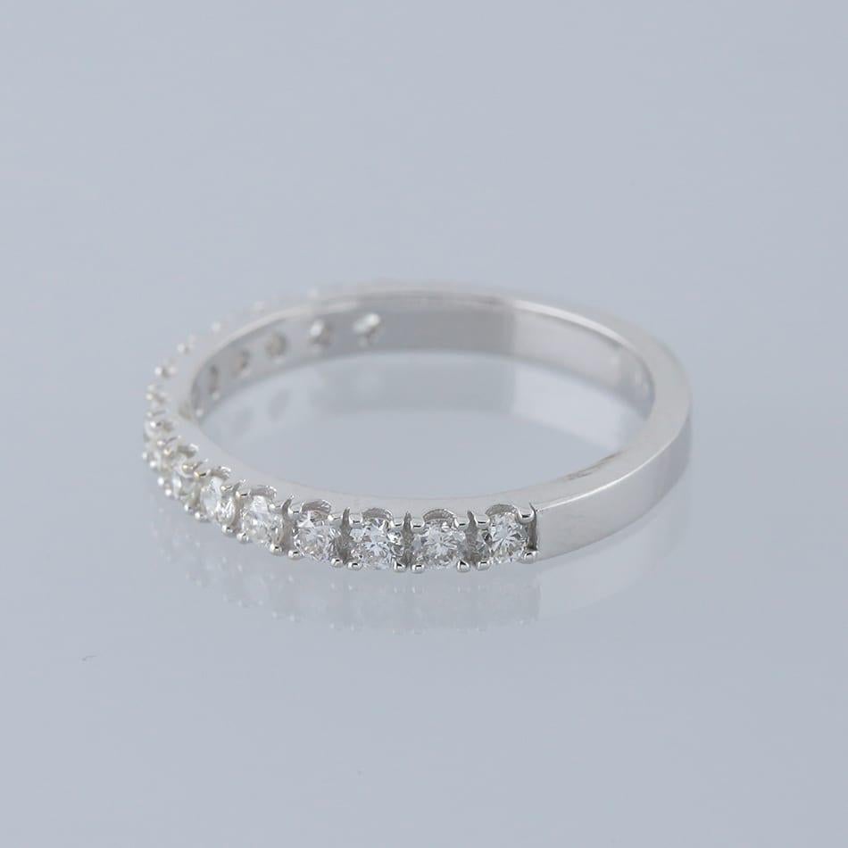 This is an 18ct white gold diamond half eternity ring. The ring features 15 claw set round brilliant cut diamonds.

Condition: Used (Excellent)
Weight: 2.1 grams
Size: J
Band Width: 2.5mm
Total Diamond Carat Weight: Approx. 0.45 carats
Diamond