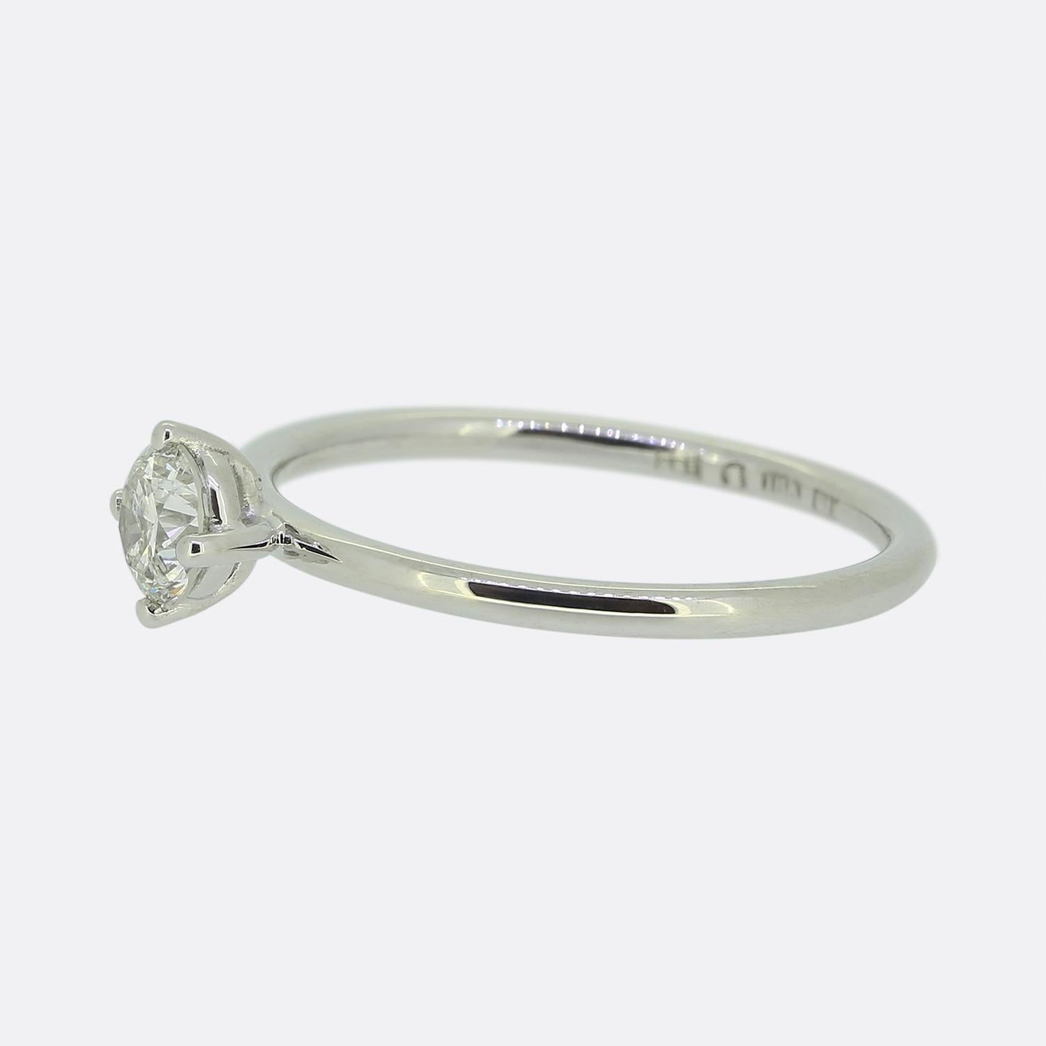 Here we have an 18ct white gold diamond solitaire ring. The ring features a single 0.45 carat round brilliant cut diamond which sits proud in a four clawed setting atop a slim smooth polished band. 

Condition: Used (Very Good)
Weight: 2.2