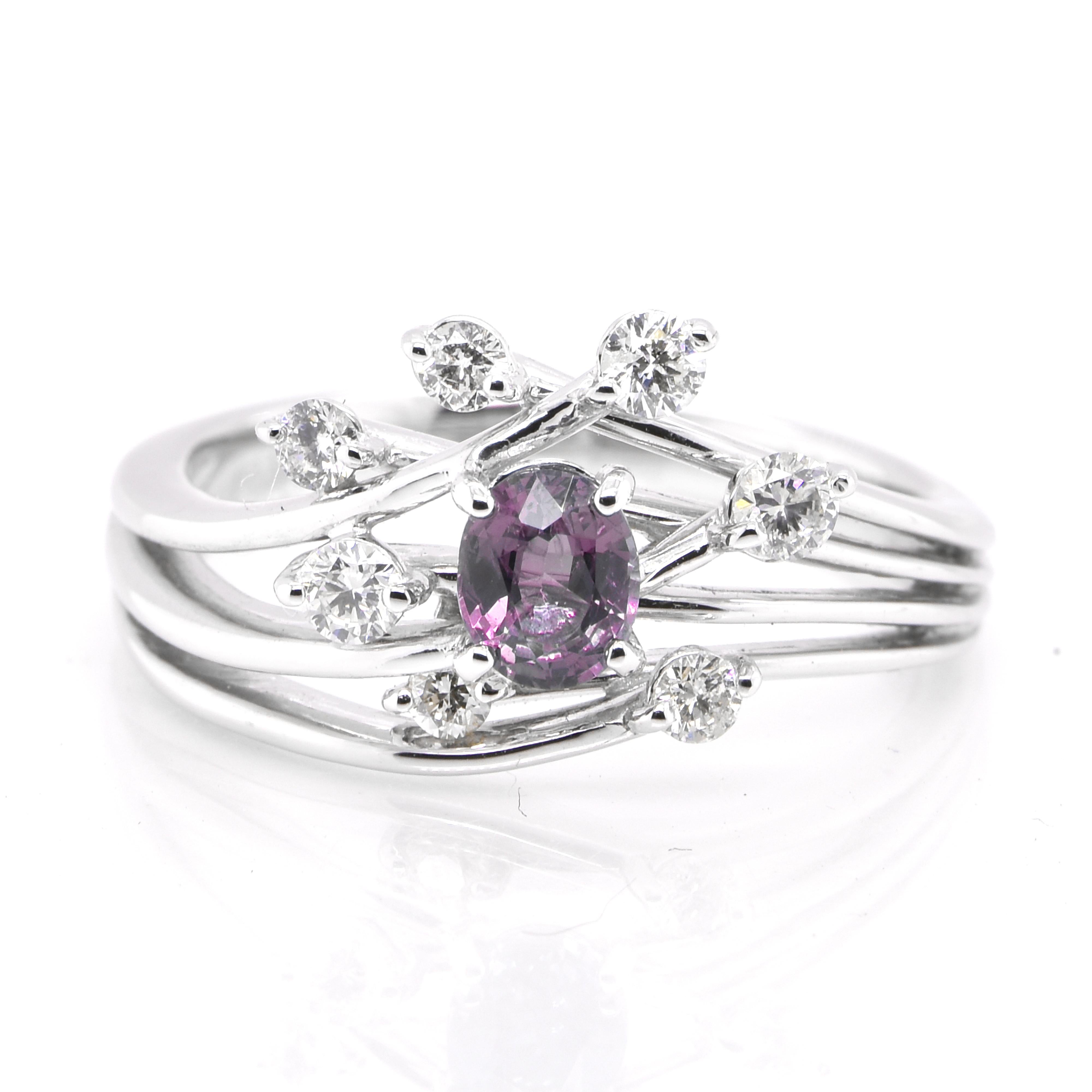 A gorgeous ring featuring a 0.45 Carat, Natural Alexandrite and 0.31 Carats of Diamond Accents set in Platinum. Alexandrites produce a natural color-change phenomenon as they exhibit a Bluish Green Color under Fluorescent Light whereas a Purplish