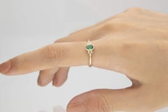 0.45 Carat Oval Cut Emerald with Diamond Accents 10K Yellow Gold Ring