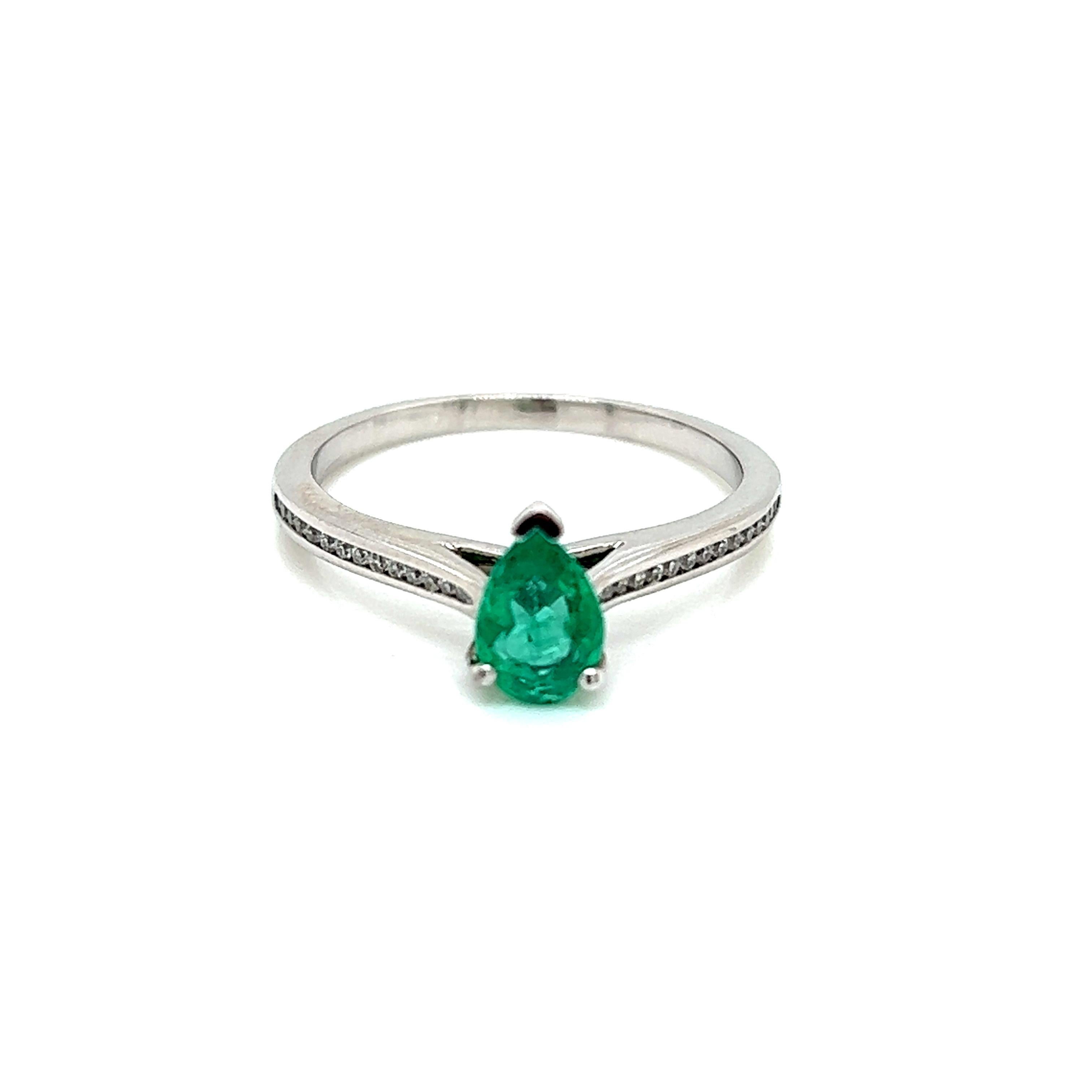 0.45 Carat Pear Shape Emerald and Diamond Ring in 18 Karat White Gold

This gorgeous ring features a luscious pear-cut Emerald held in a claw setting on a Diamond encrusted 18K White Gold band.

The Emerald weighs a total of 0.45 carats. It is an