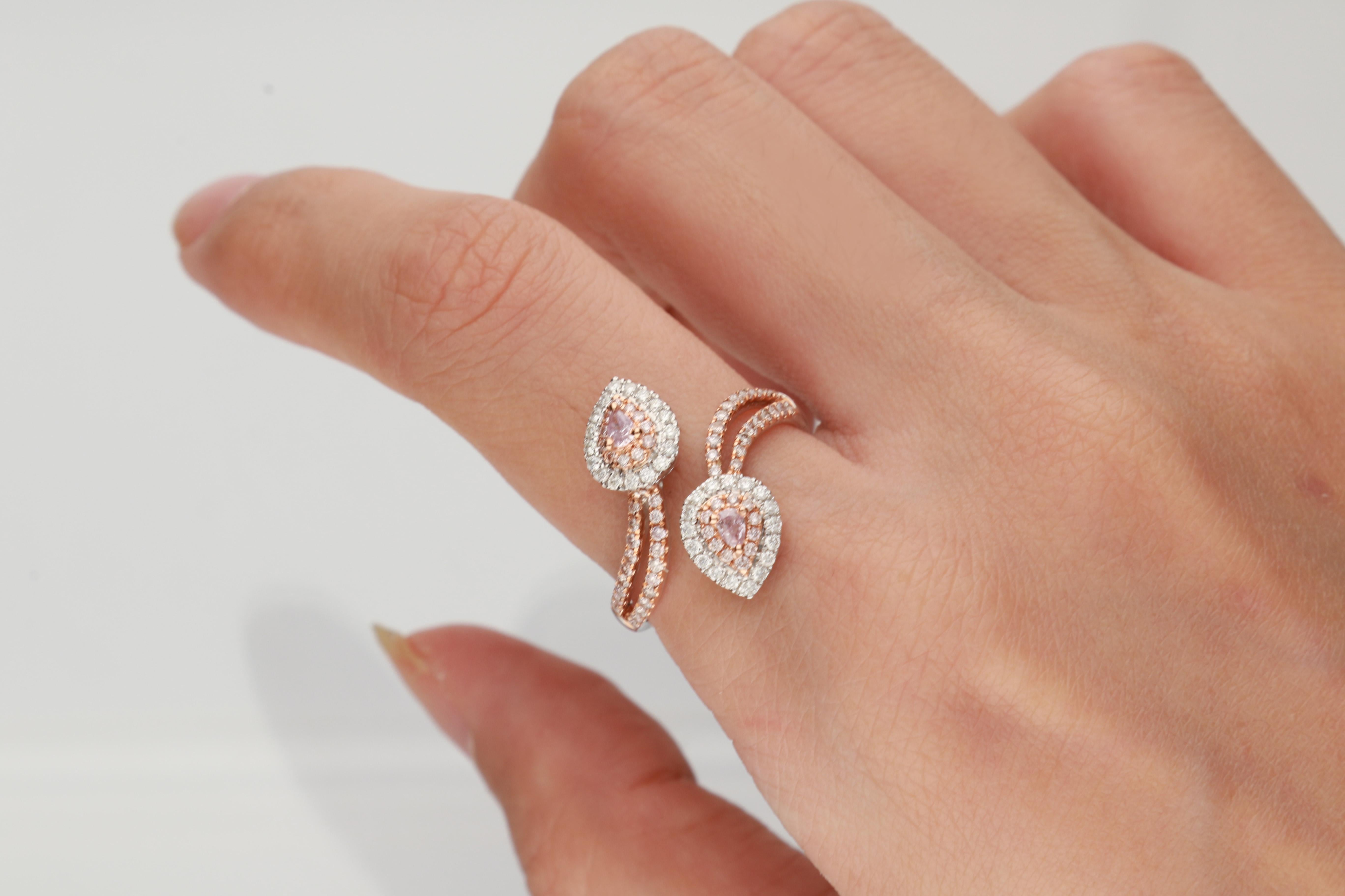 This beautiful Ring is crafted in 18-karat Triple Tone Gold and features an 64 Pcs Round Cut  0.45 Carat Pink Diamond. This ring also features 34 Pcs White Round diamonds 0.21 carat  in GH-SI quality. 
This ring comes in size 7 and can be resized to