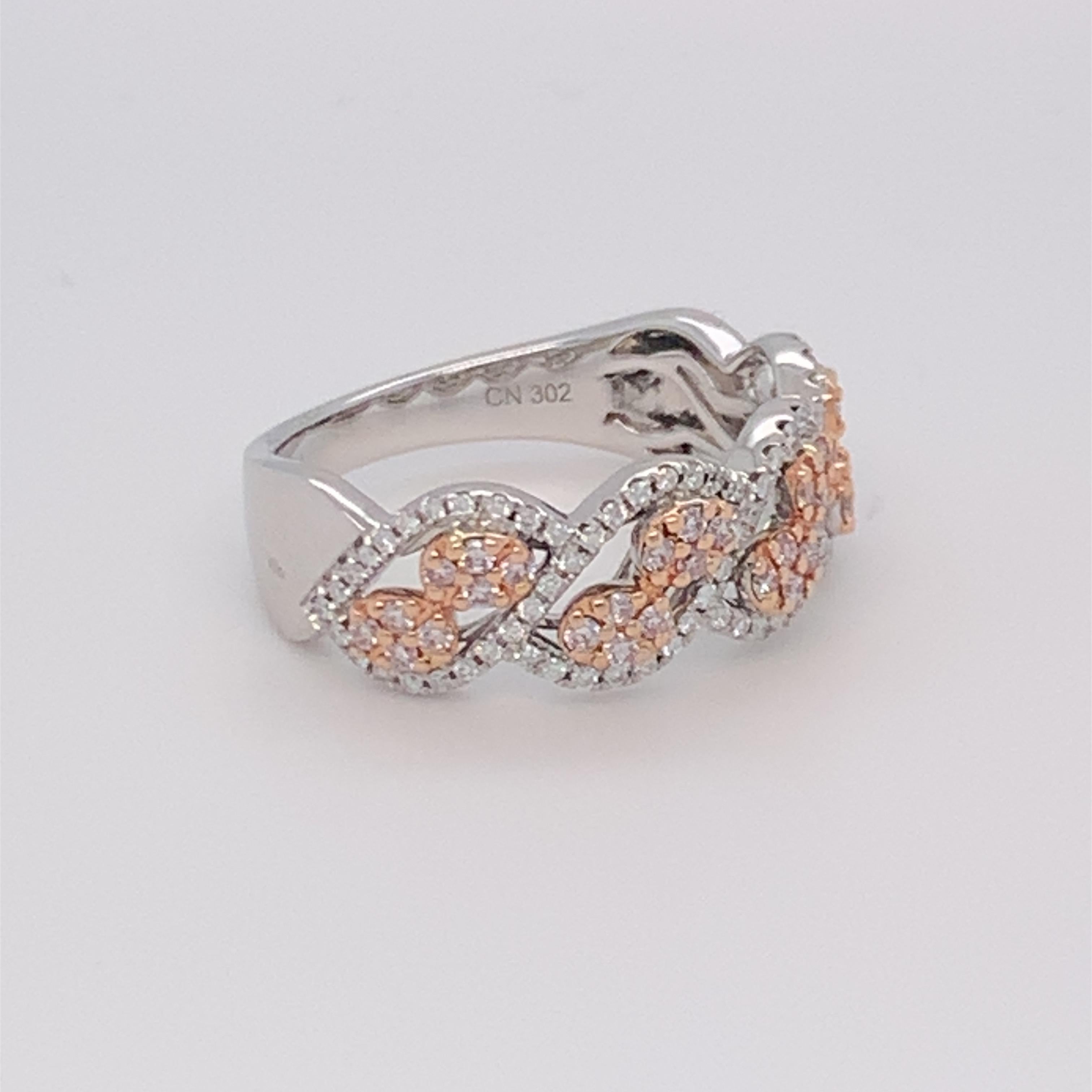 This beautiful diamond band has a combination of pink and white diamonds, which is suitable for everyday wear. Carefully finished with hand by skilled craftsmen and mounted in 14K two tone gold.  
Pink Diamond: 0.25ct
White Diamond: 0.20ct
Gold: 14K