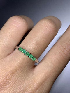 0.45ct Colombian green emerald eternity wedding ring in platinum
