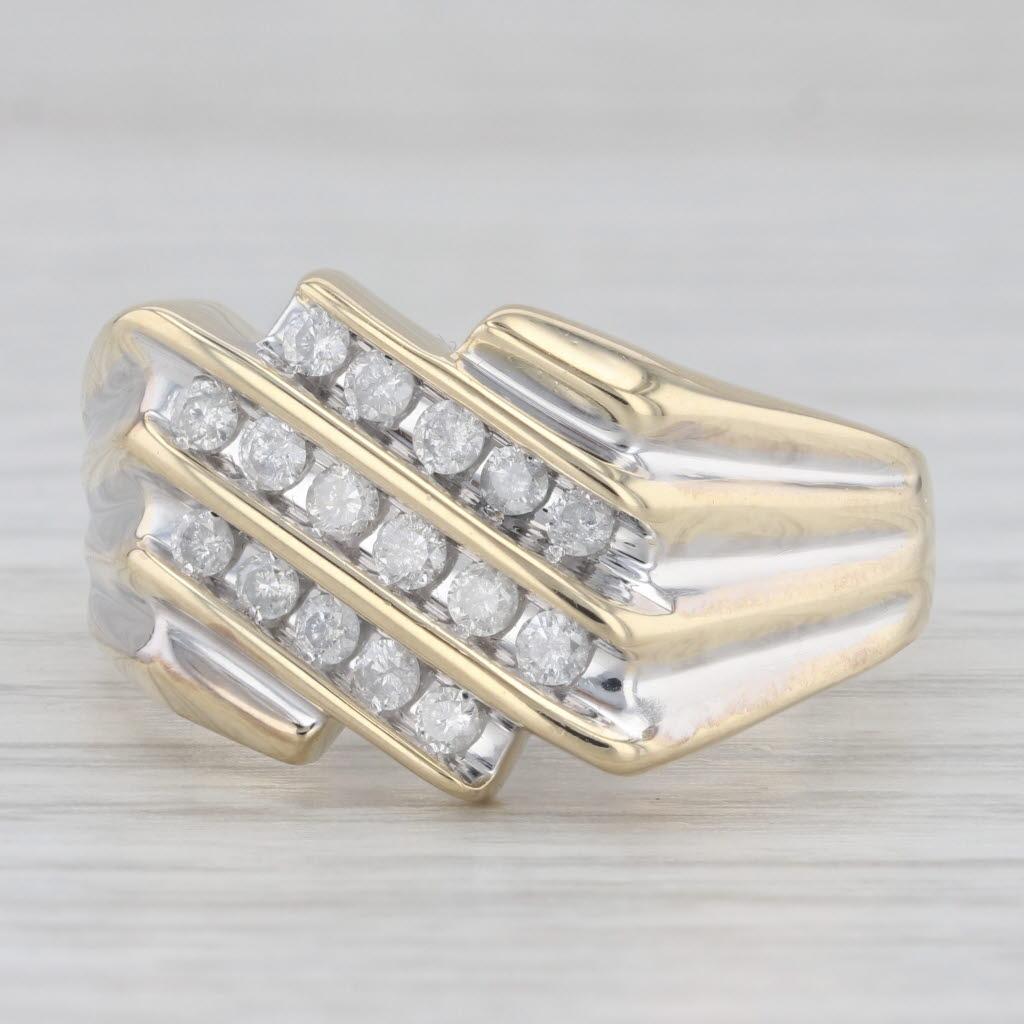 Gemstone Information:
- Natural Diamonds -
Total Carats - 0.45ctw
Cut - Round Brilliant
Color - H - I
Clarity - I1 - I2

Metal: 10k Yellow Gold, White Gold Accenting 
Weight: 6.8 Grams 
Stamps: 10k
Face Height: 14.6 mm 
Rise Above Finger: 4 mm
Band