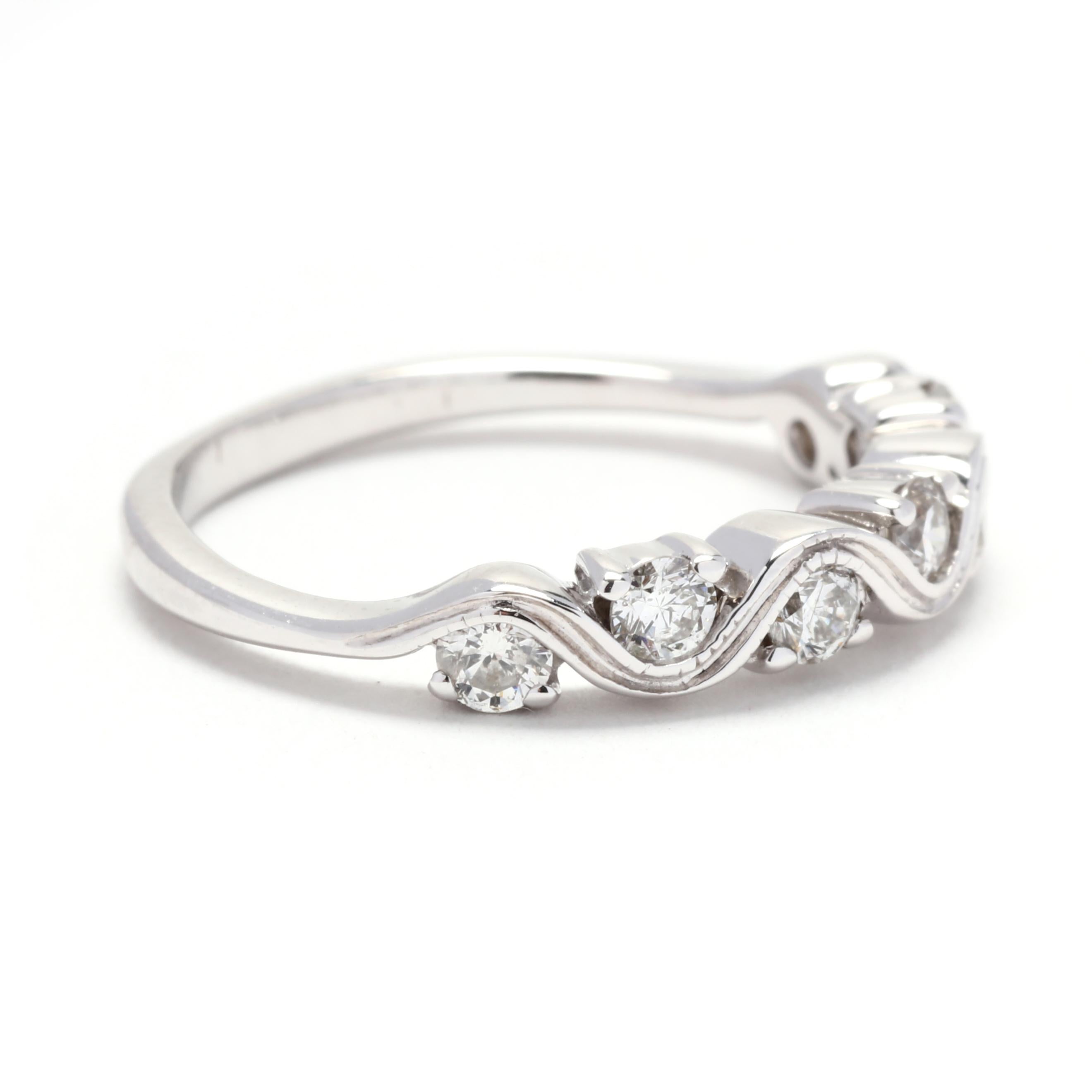 This stunning diamond swirl wedding band is the perfect addition to your bridal set. Crafted in 14K white gold, this ring features a delicate swirl design adorned with dazzling round diamonds. The total carat weight of this band is 0.45ctw, adding a