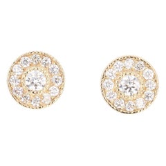 Boucles d'oreilles en or jaune avec diamant de 0,46 carat à taille ronde