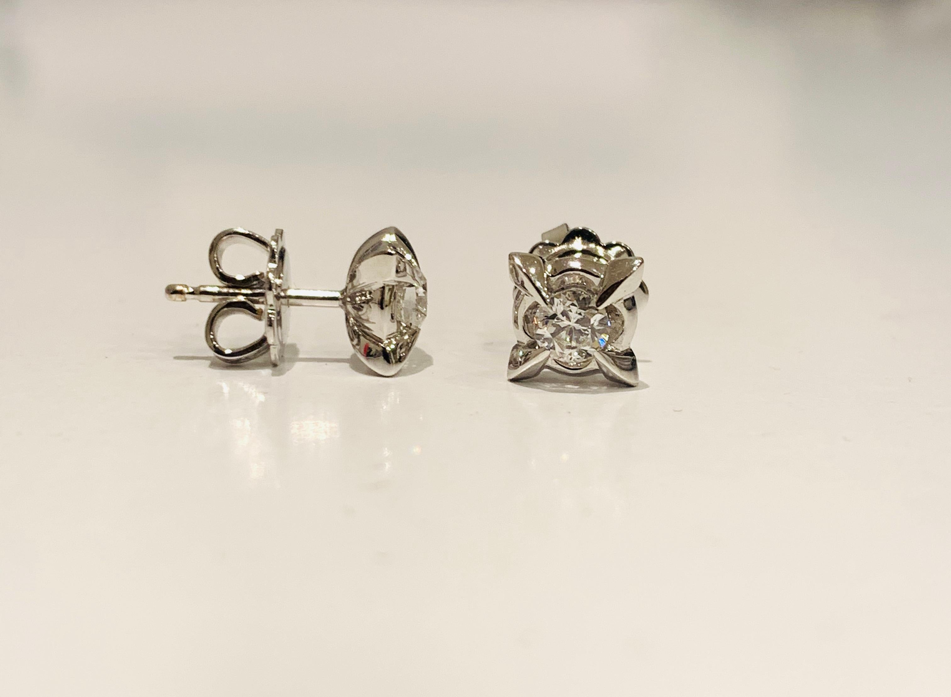 These 0.46 Carat Diamond stud earrings are set in 18Kt white Gold. From the Leonardo da Vinci Cut Renaissance line. The diamond was cut using the divine proportions and is based on Leonardo's stone drawings. 

Secured on the ear with butterfly back