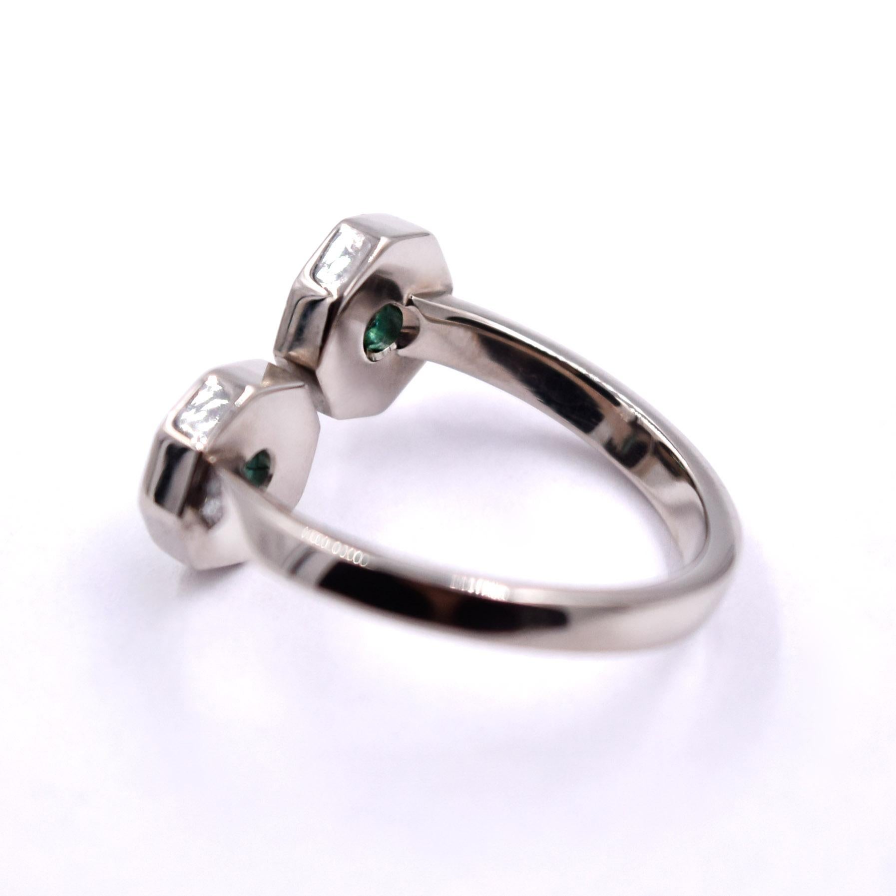 Contemporary 0.46 Carat Emerald and 0.38 Carat White Diamond Bypass Diamond Ring For Sale