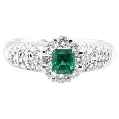 0.46 Carat Natural Emerald and Diamond Engagement Ring Set in Platinum