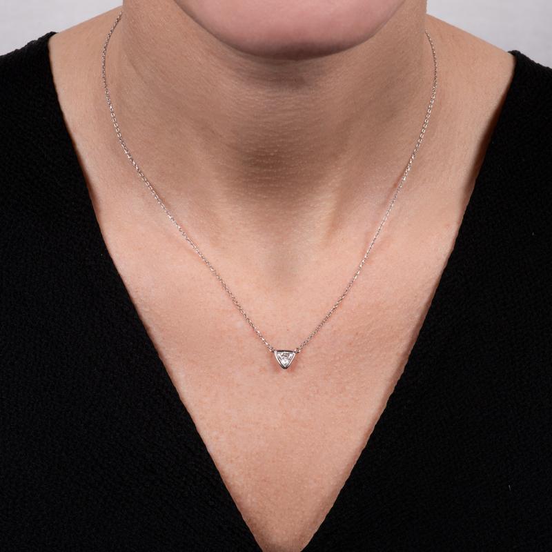 This unique necklace features a 0.46 carat trillion cut natural diamond that is bezel set in 14 karat white gold. It is set onto a 14 karat white gold diamond cut adjustable chain. Wear alone or layer with your other favorite necklaces for your own