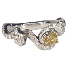 0.46 Cts Fancy Diamond on "Ribbon" 18 Kt Gold d'Avossa Ring