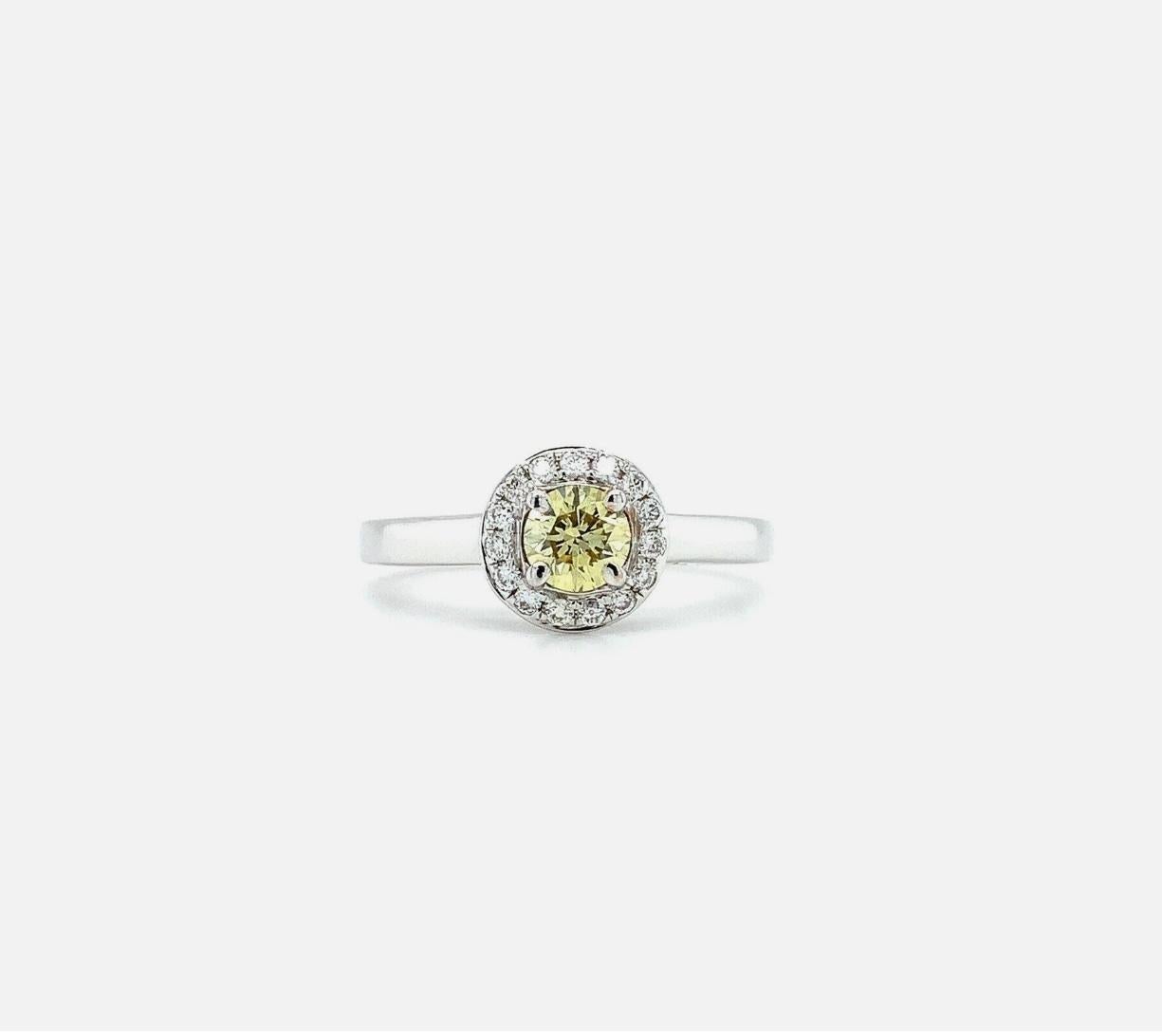Round Cut 0.46ct Fancy yellow diamond IGI solitaire engagement ring 18ct white gold For Sale