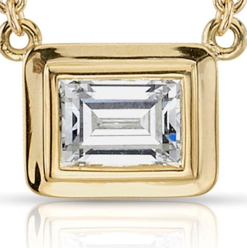 0.46ct G/VVS1 GIA certified Emerald cut diamond set in a handcrafted 18K yellow pendant. Necklace is on a 16