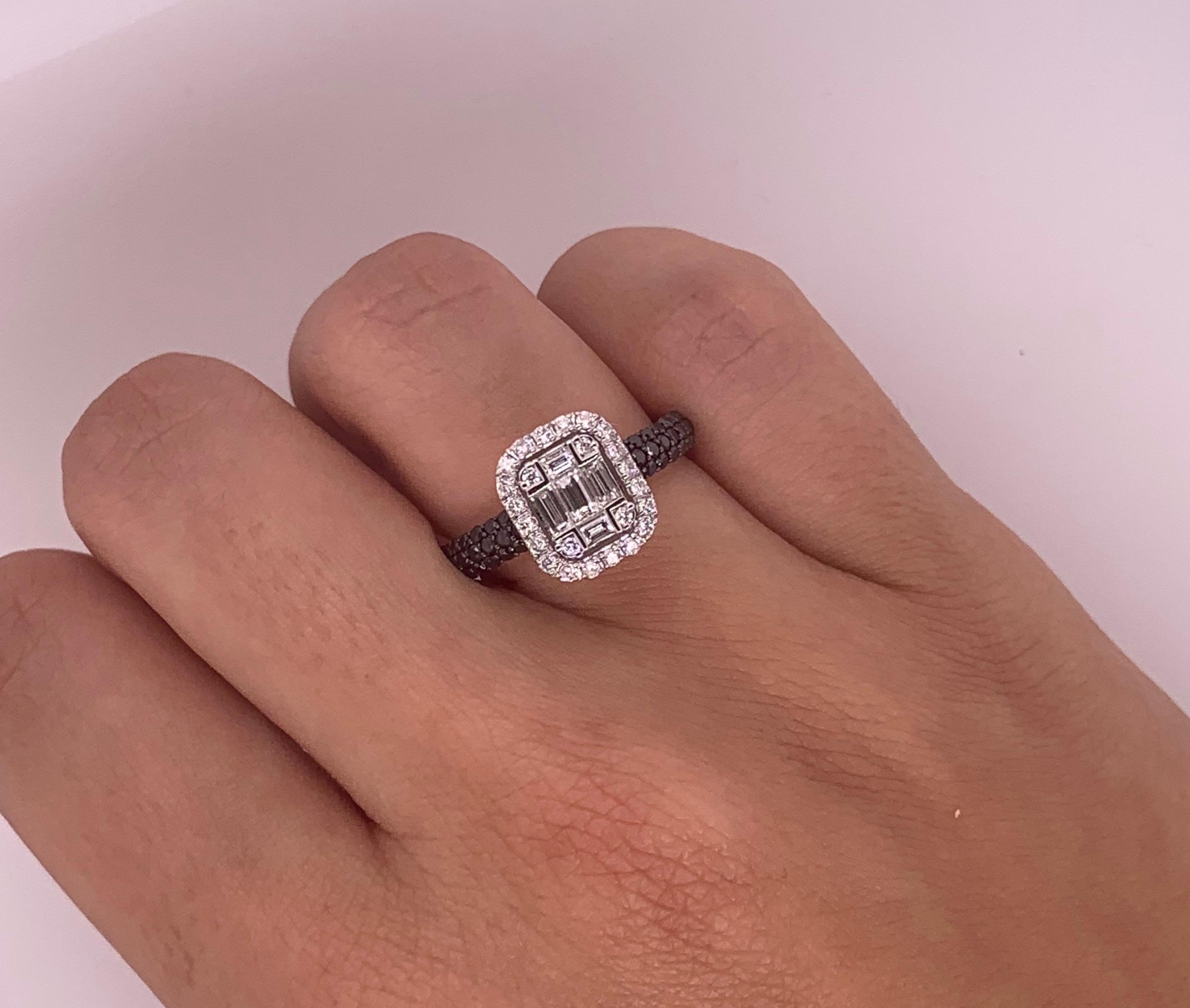 Material: 18k White Gold 
Stone Details: 50 Round Black Diamond at 0.47 Carats
Diamond Details: 24 Round White Diamonds at 0.21 Carats
Diamond Details: 5 Baguette Diamonds at 0.31 Carats
The face of this ring measures 9.5 x 11 millimeters.

Alberto