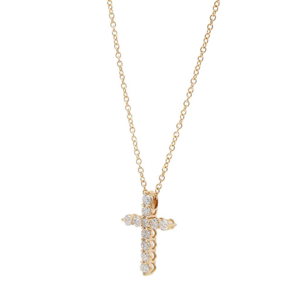 Add a touch of modern elegance to your jewelry collection with this 0.46 Carat 18K Yellow Gold Cross Pendant Necklace. This contemporary cross pendant beams brightly with diamonds encrusted all over its surface, creating a captivating sparkle.