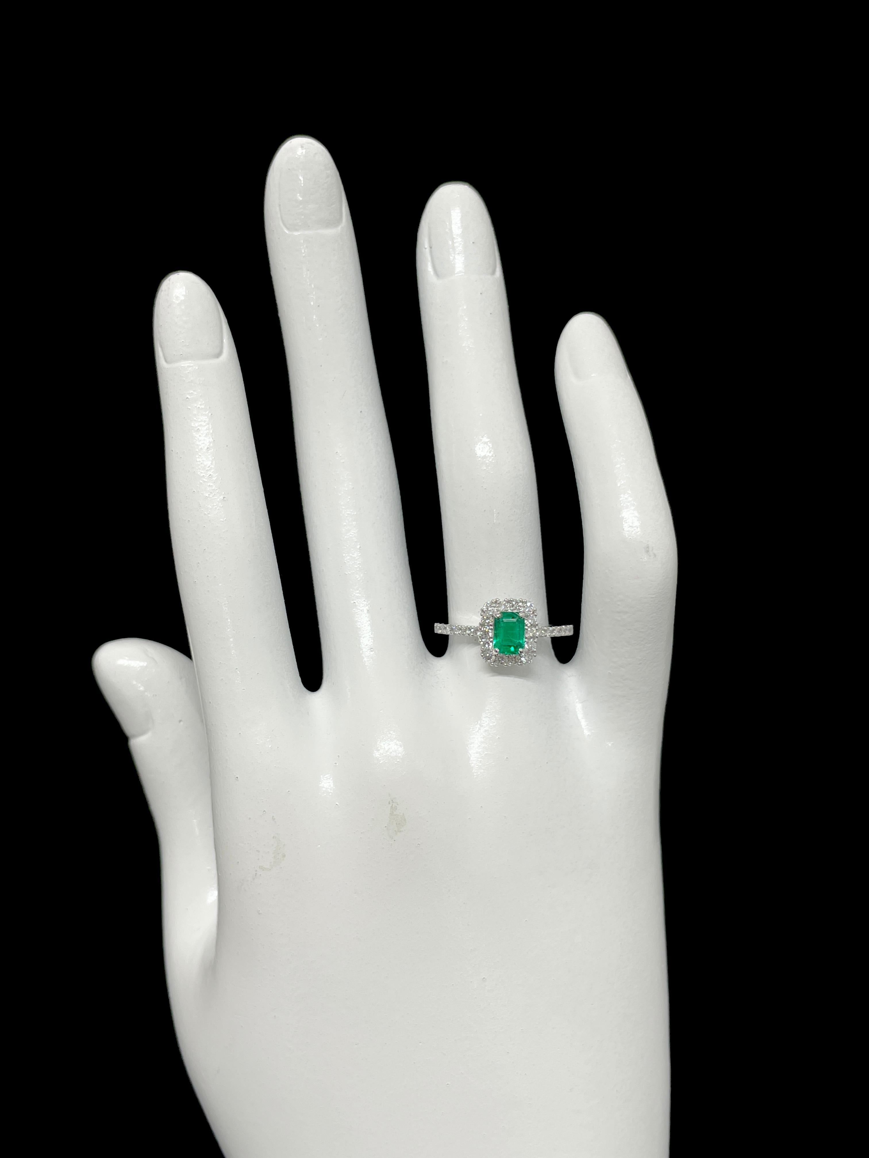 0.47 Carat Natural Emerald and Diamond Engagement Ring Set in Platinum 1