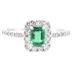 0.47 Carat Natural Emerald and Diamond Engagement Ring Set in Platinum