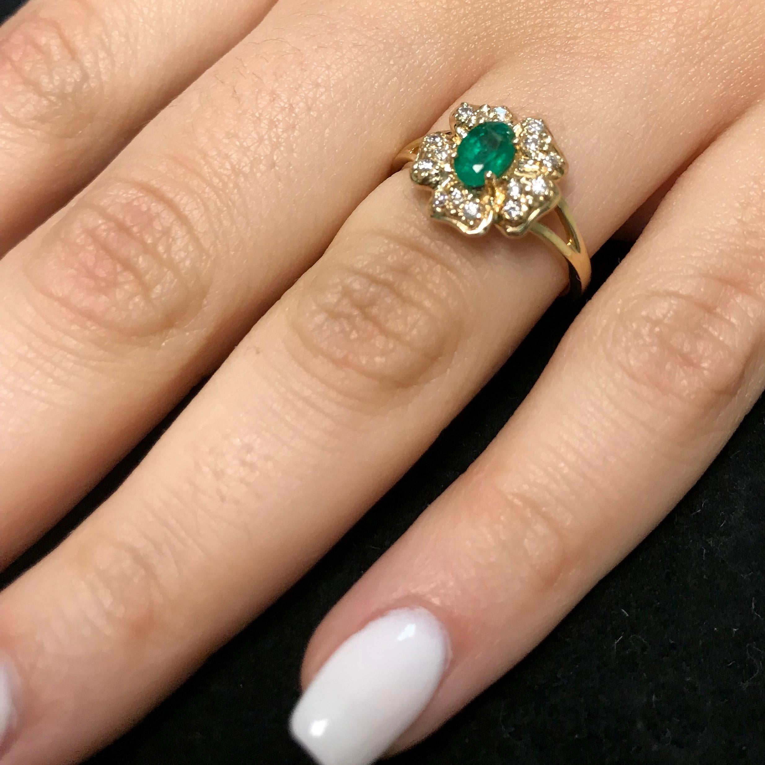 Material: 14k Yellow Gold 
Color Stone Details:  0.47 Carat Oval Cut Emerald 
Center Stone Details: 15 Round Cut White Diamonds at 0.15 Carats Clarity: SI  / Color: H-I
Ring Size: Size 6.5. Alberto offers complimentary sizing on all rings.

Fine