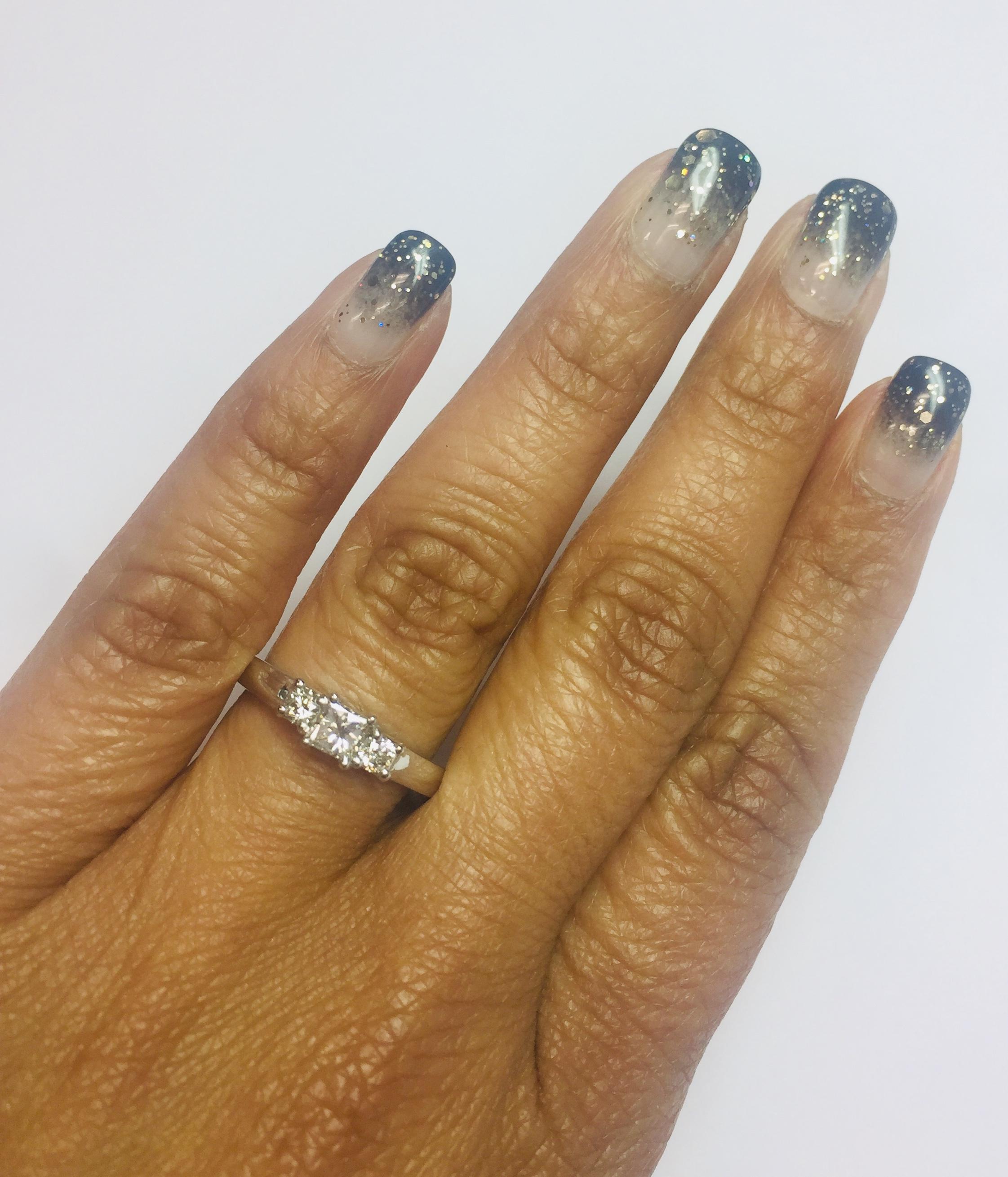 Modern 0.47 Carat Three-Stone Diamond 18 Karat White Gold Ring